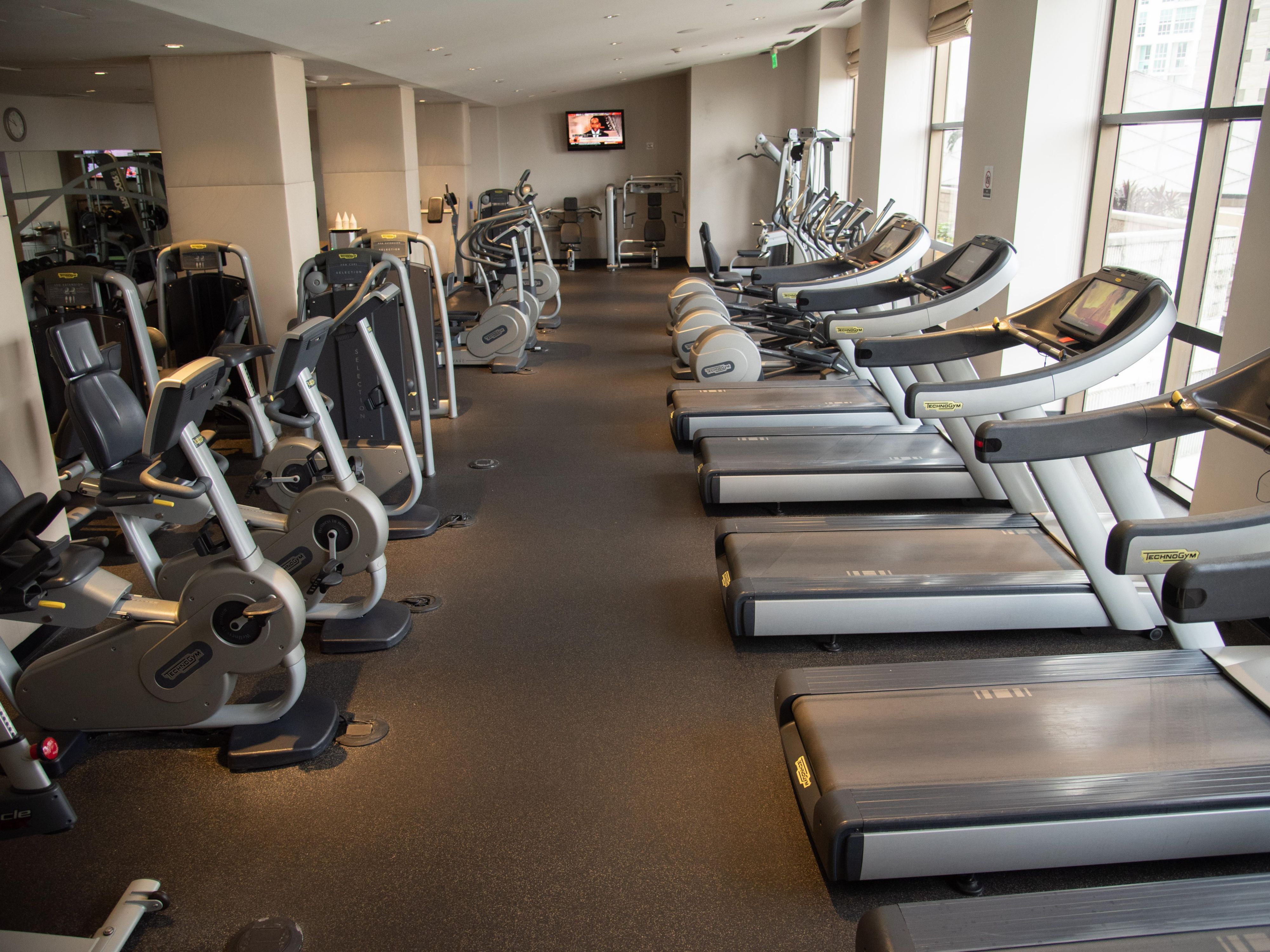 Fitness center with cardio equipment.