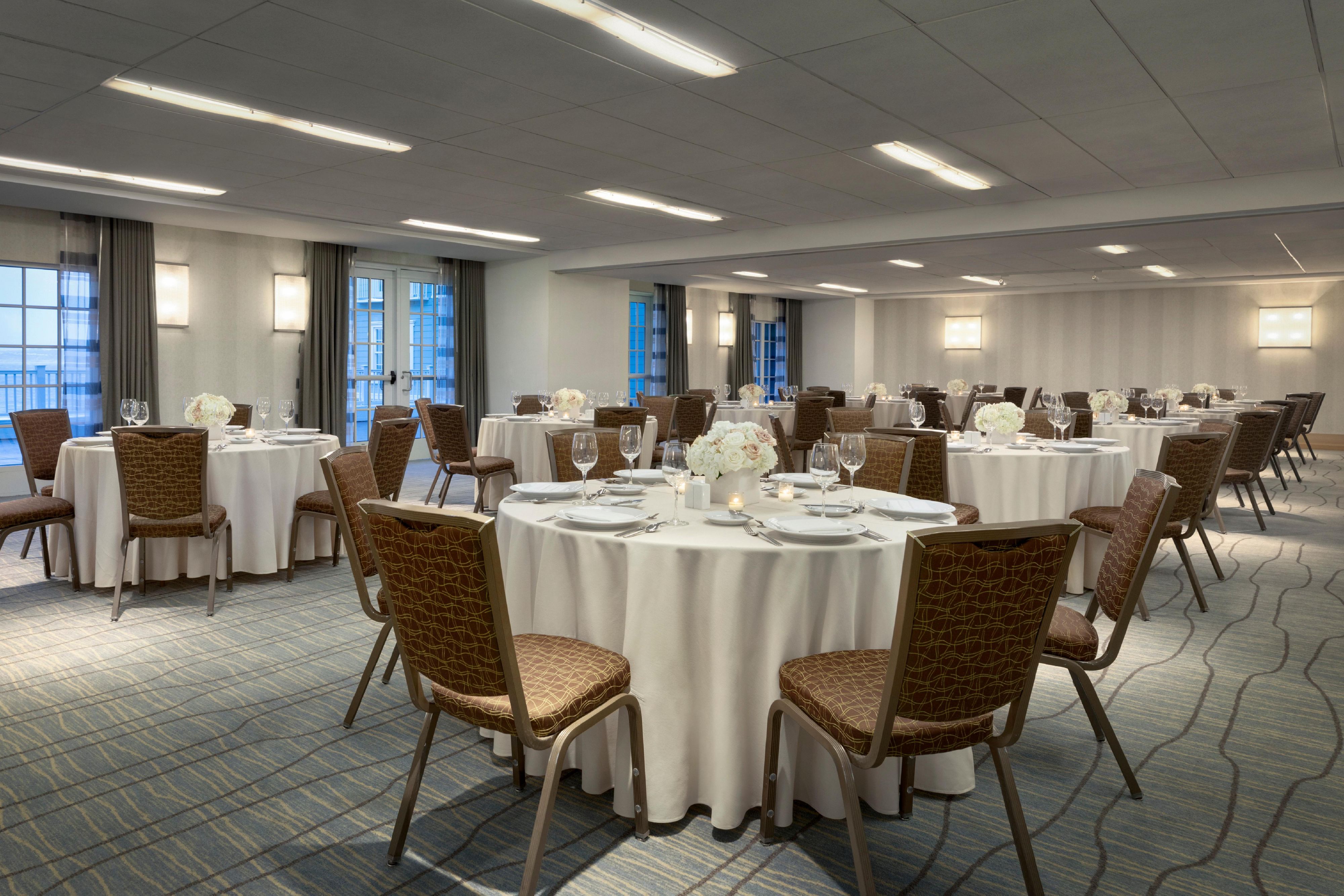 Pacific banquet room set up with round tables.