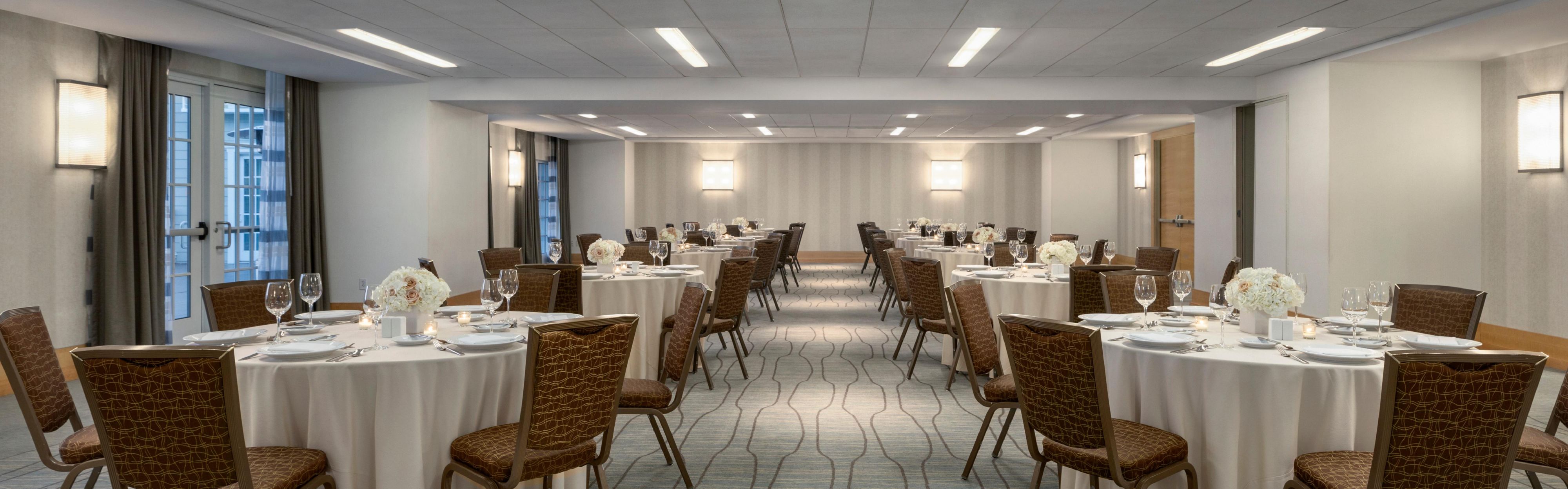 Event venue with round tables.
