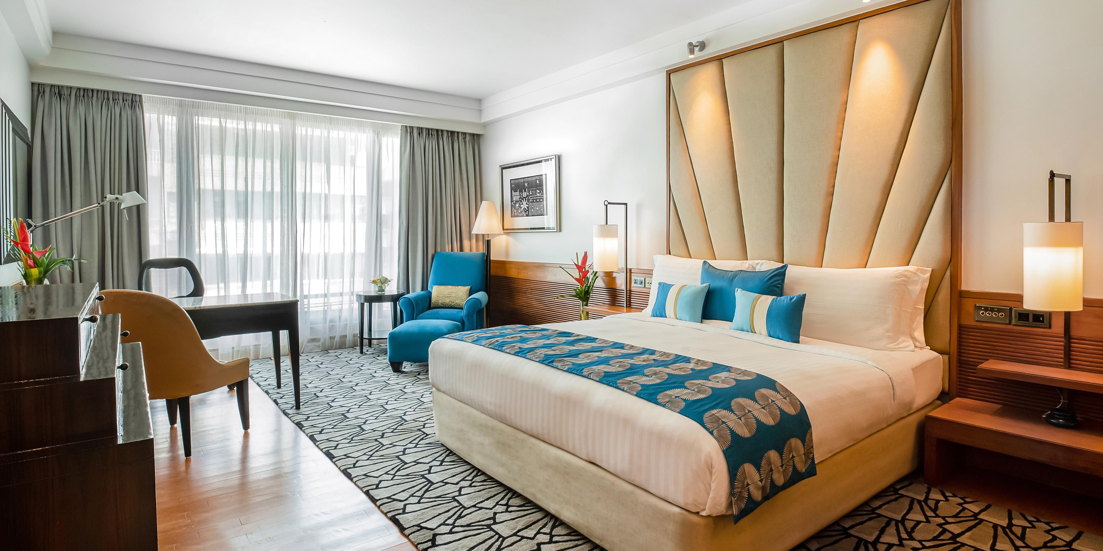 Luxurious guest room with a partial sea view