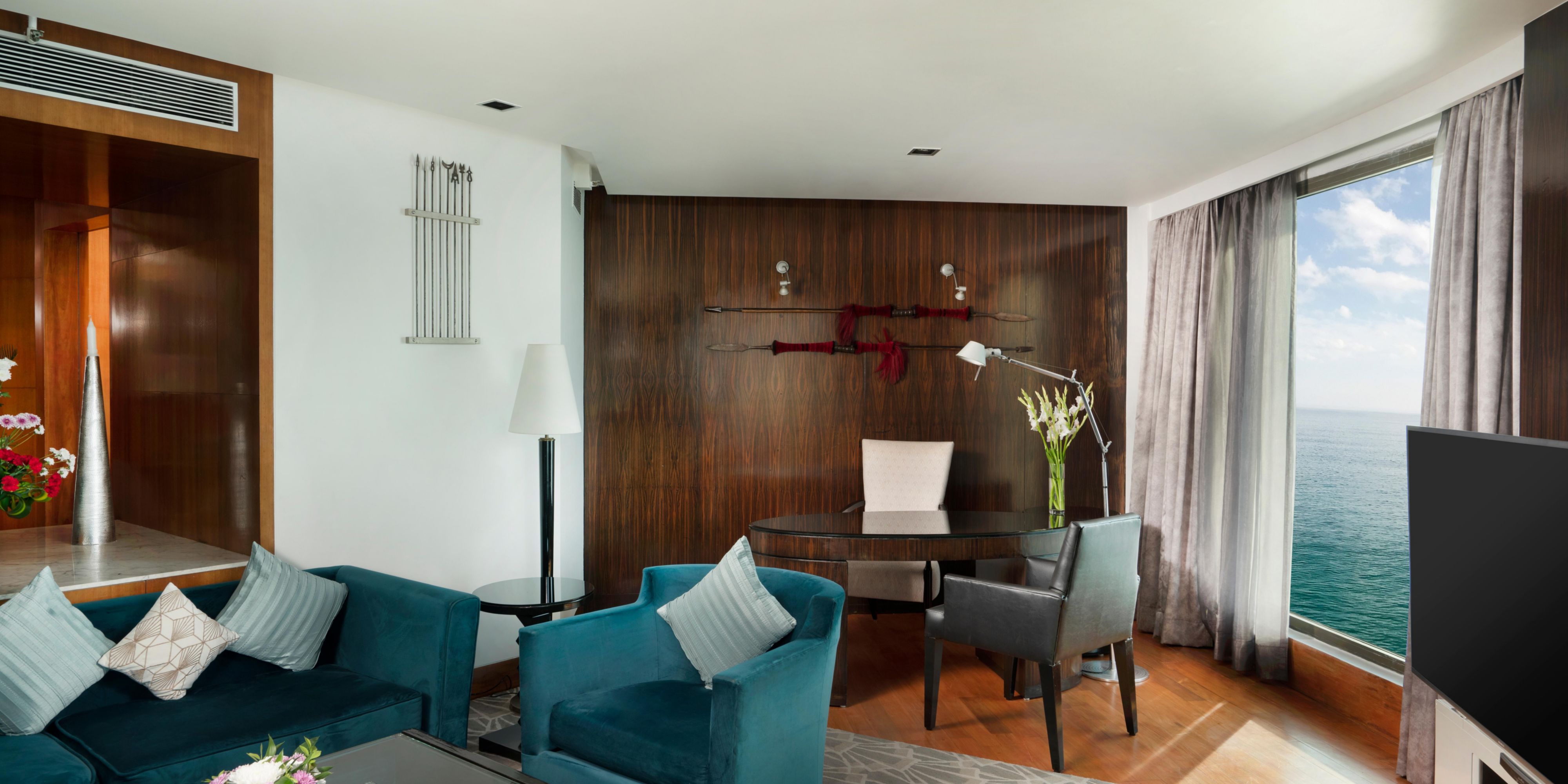 The luxury suite features a sea facing living room and work space