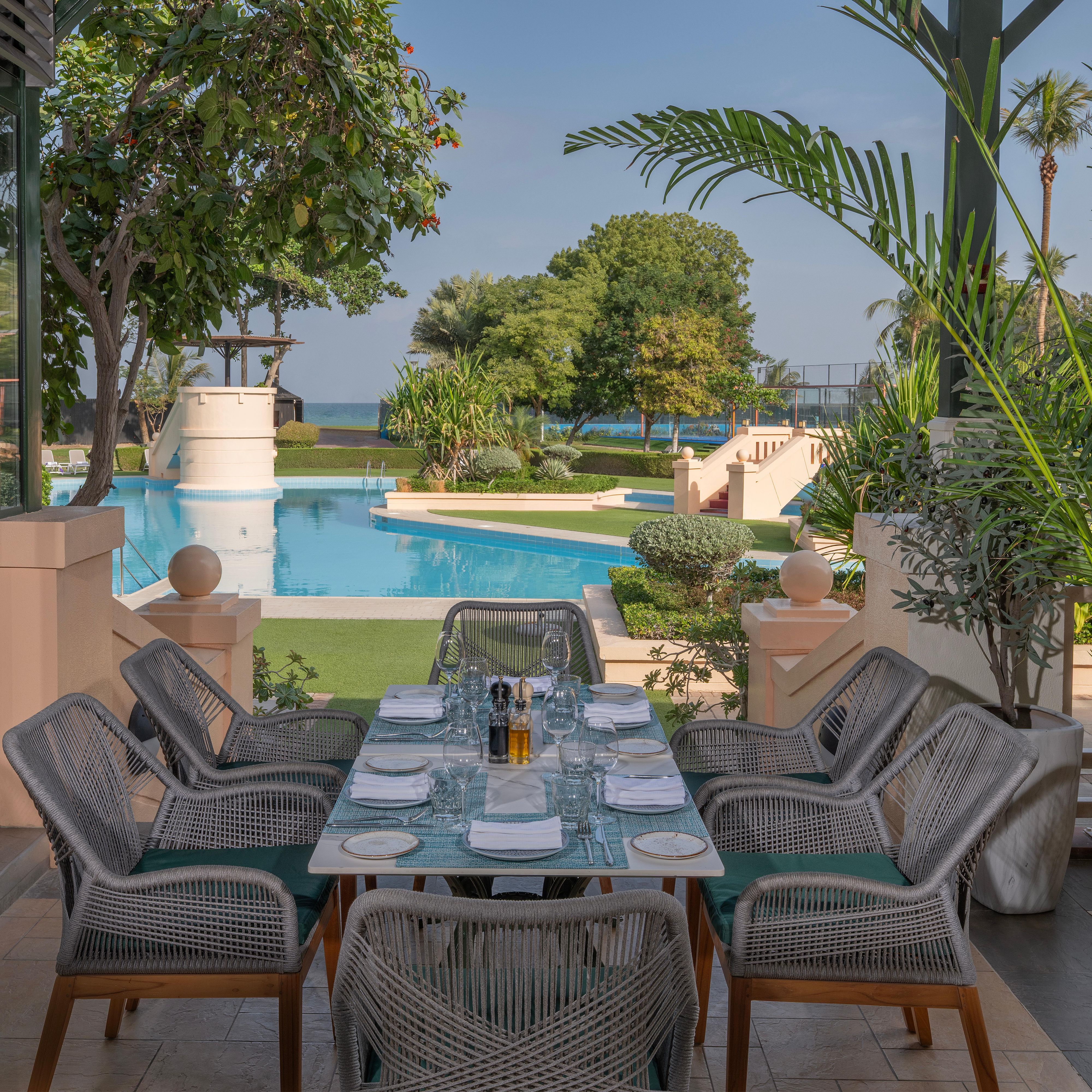 Tomato Outdoor Dining Overlooking the Pool