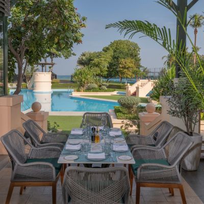 Tomato Outdoor Dining Overlooking the Pool