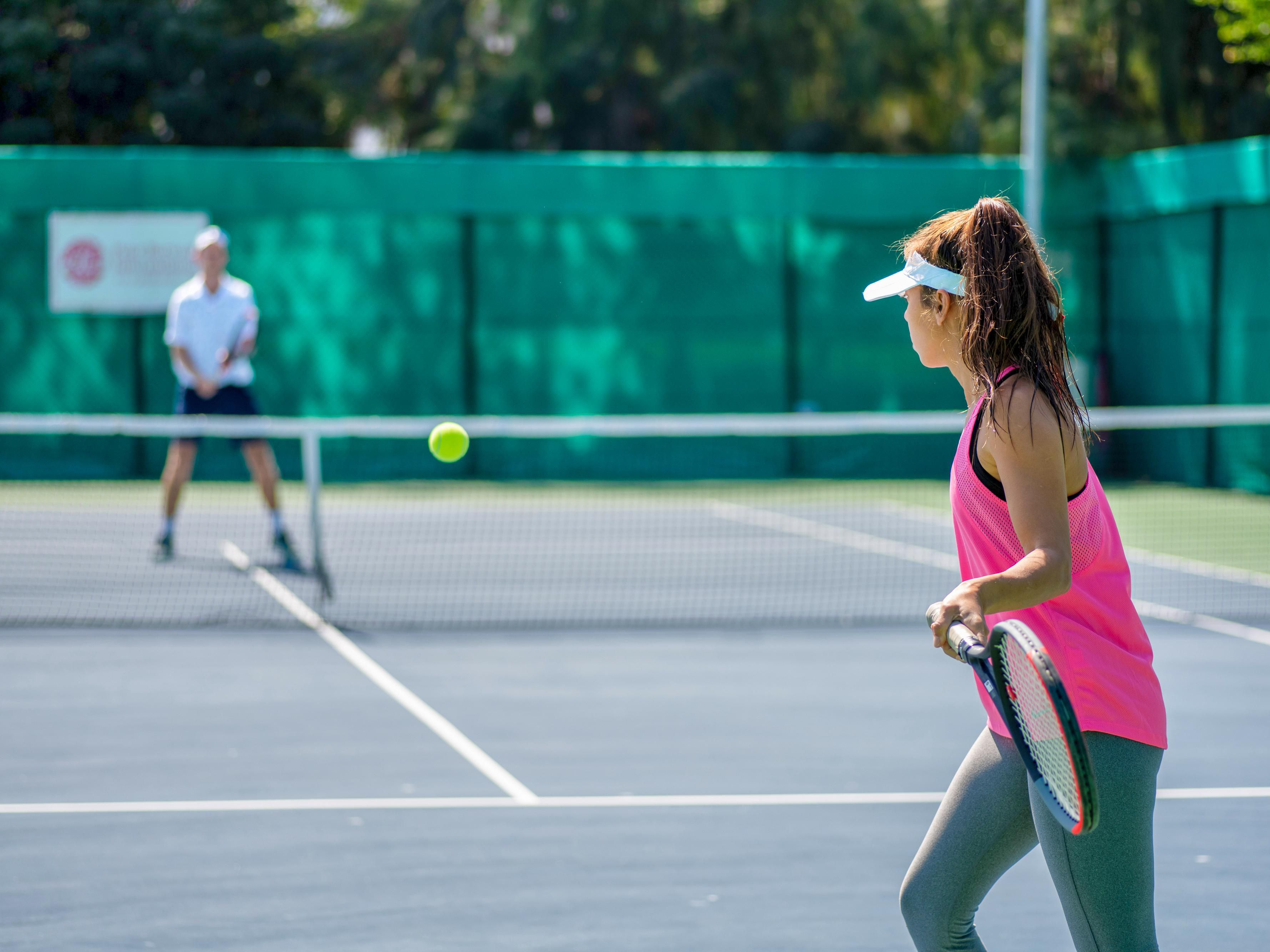 Tennis match on outdoor court