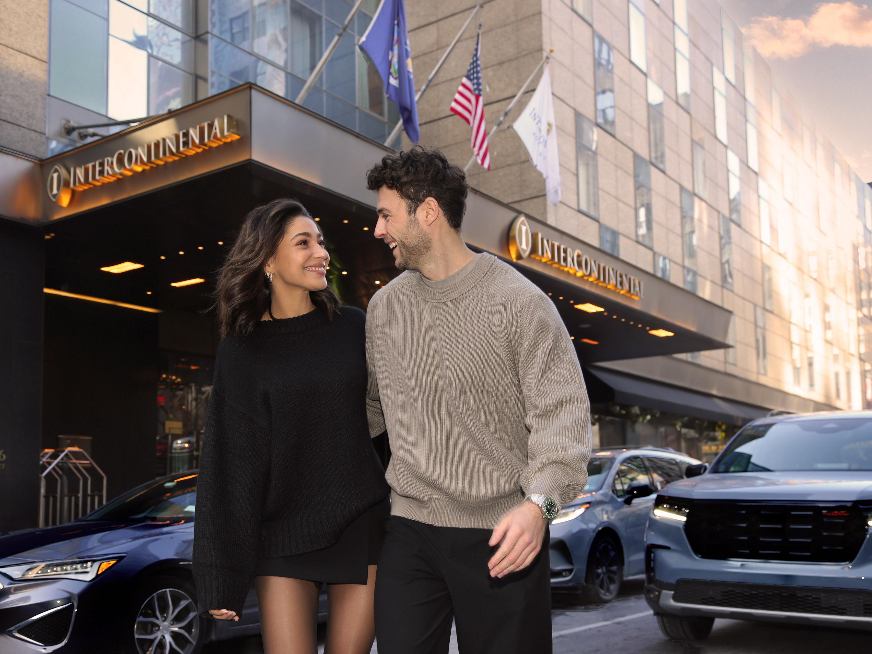 Couple walking outside the canopy entrance
