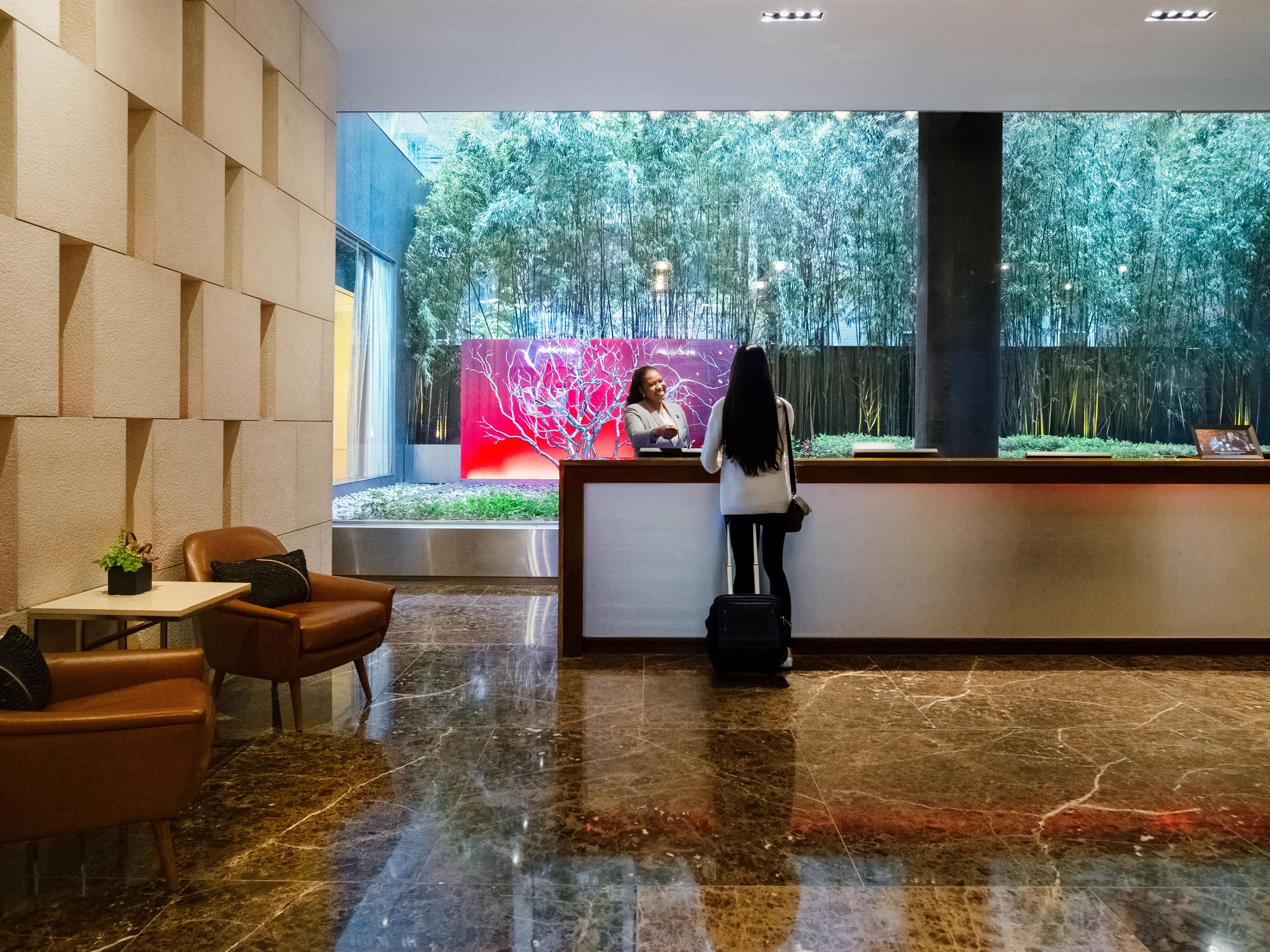 Warm lobby with views of the serene Zen Garden