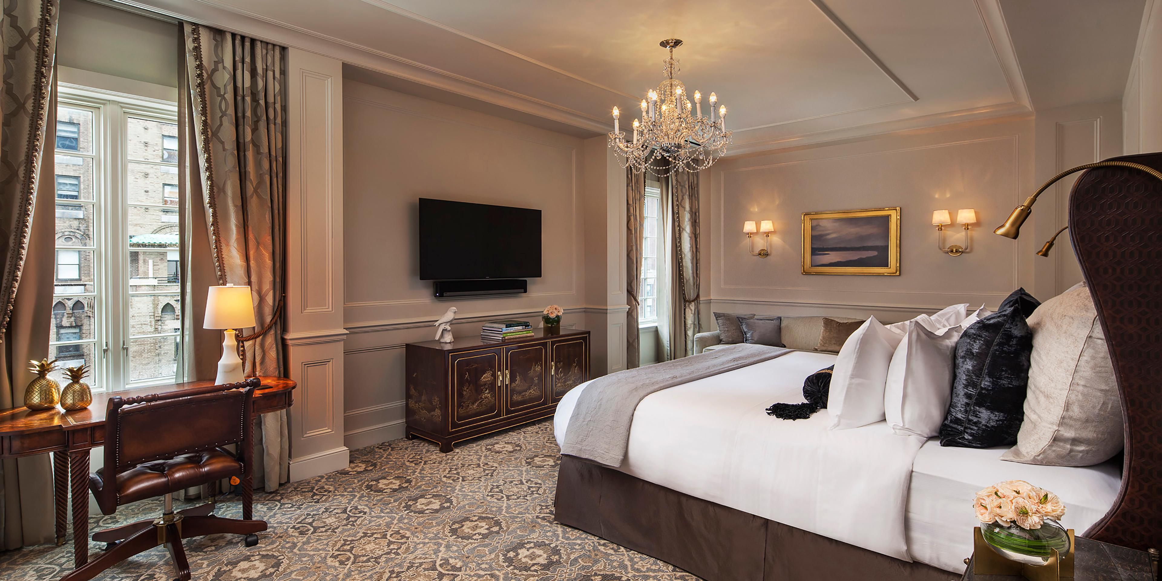 Elegant Penthouse Master Bedroom with Seating Area