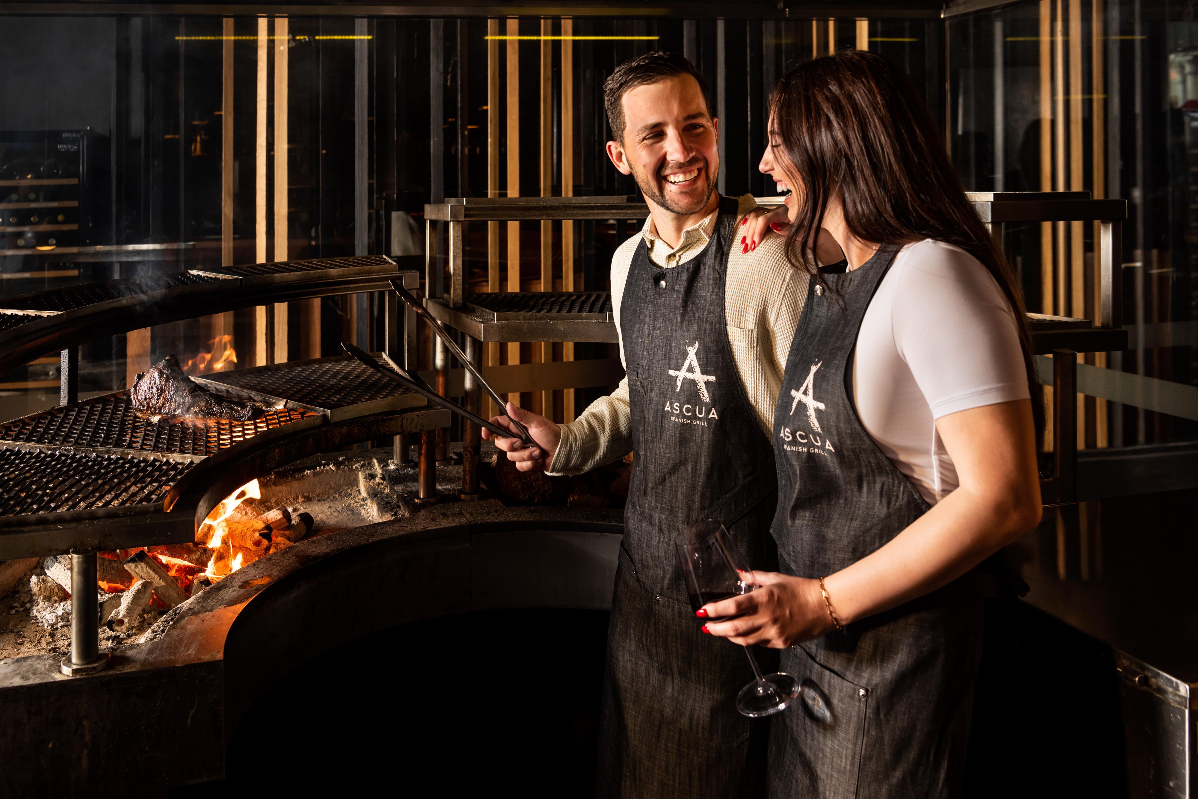 Couple enjoying Masterclass at Ascua.