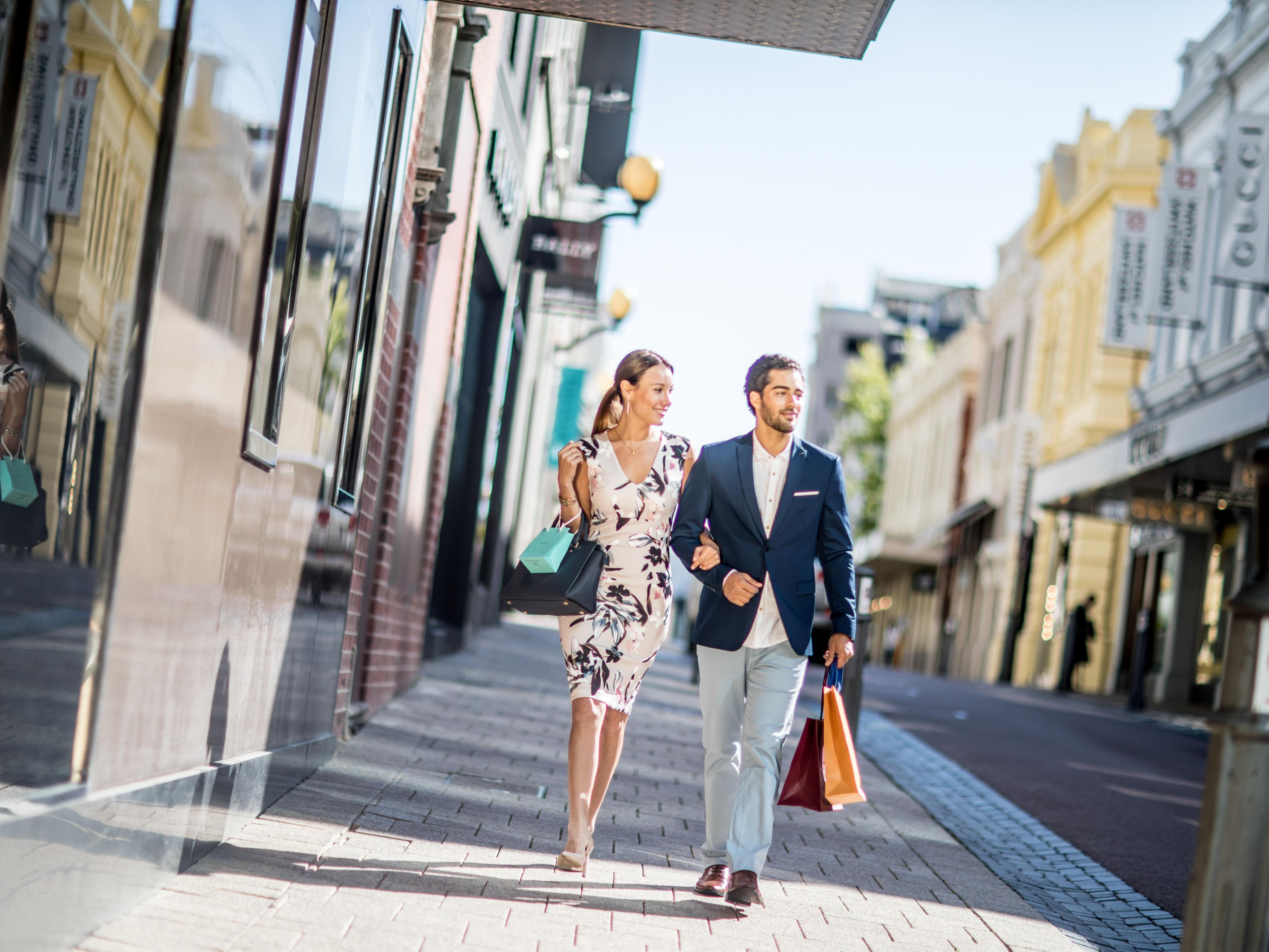 Couple shopping in King St & Raine Square Luxury Shopping District.