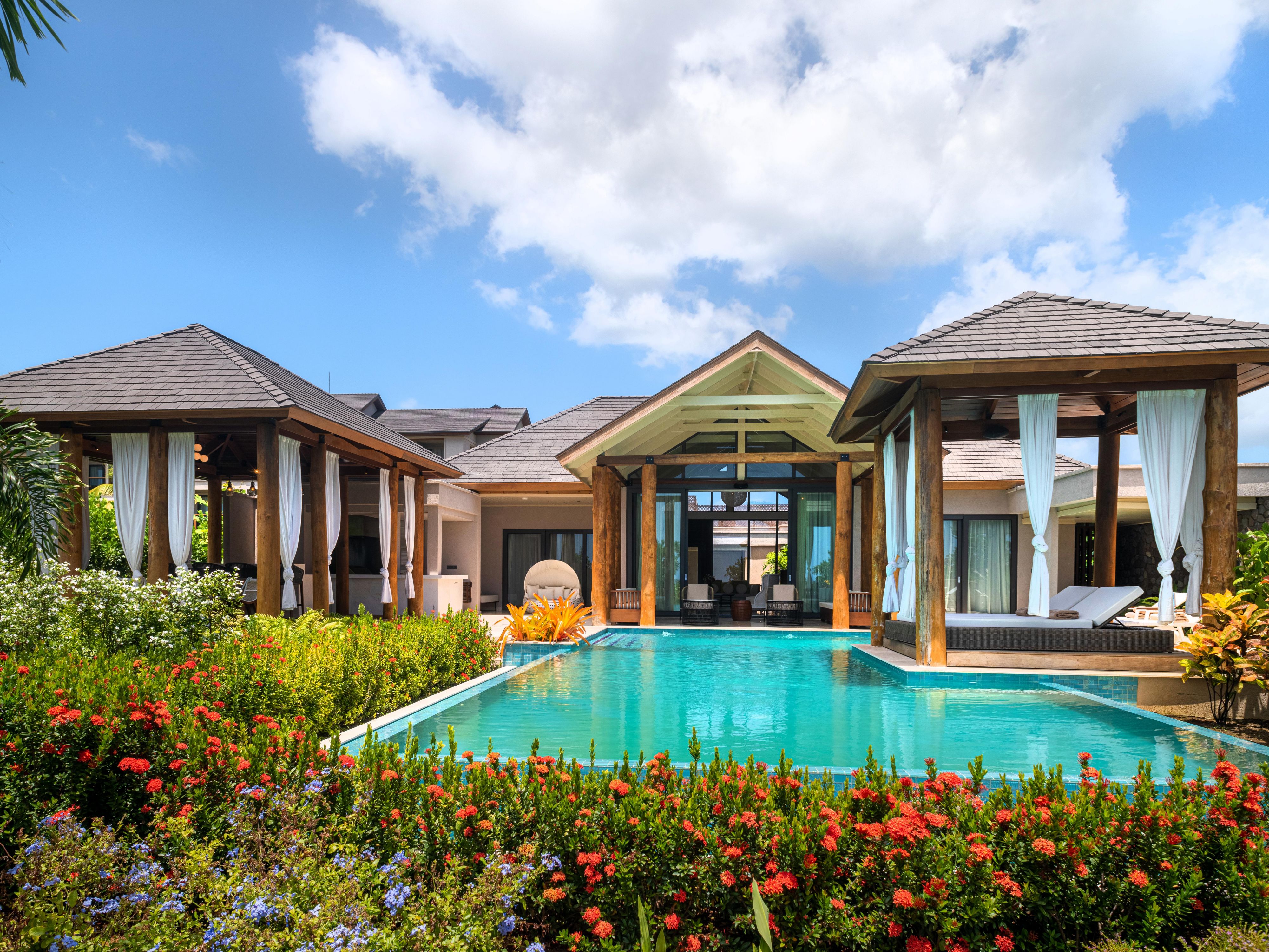 Take a morning dip in your presidential villa swimming pool.