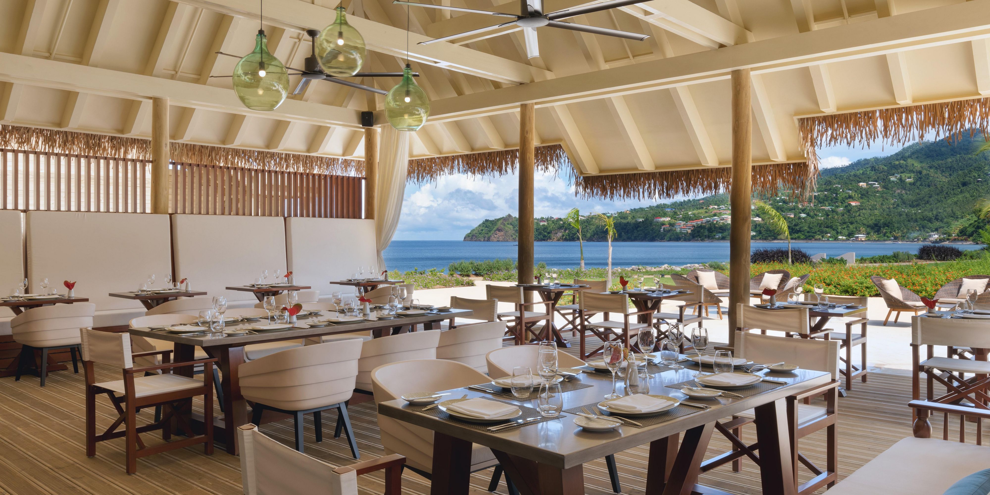 Dine al fresco and savor creative, local fare at our restaurants and bars. Enjoy a breakfast buffet at Cabrits Market or a laid-back lunch at Kwéyòl Beach Café. Visit our swim-up bar for drinks and snacks during your day of relaxation or sip rum cocktails infused at the Rumfire Bar.