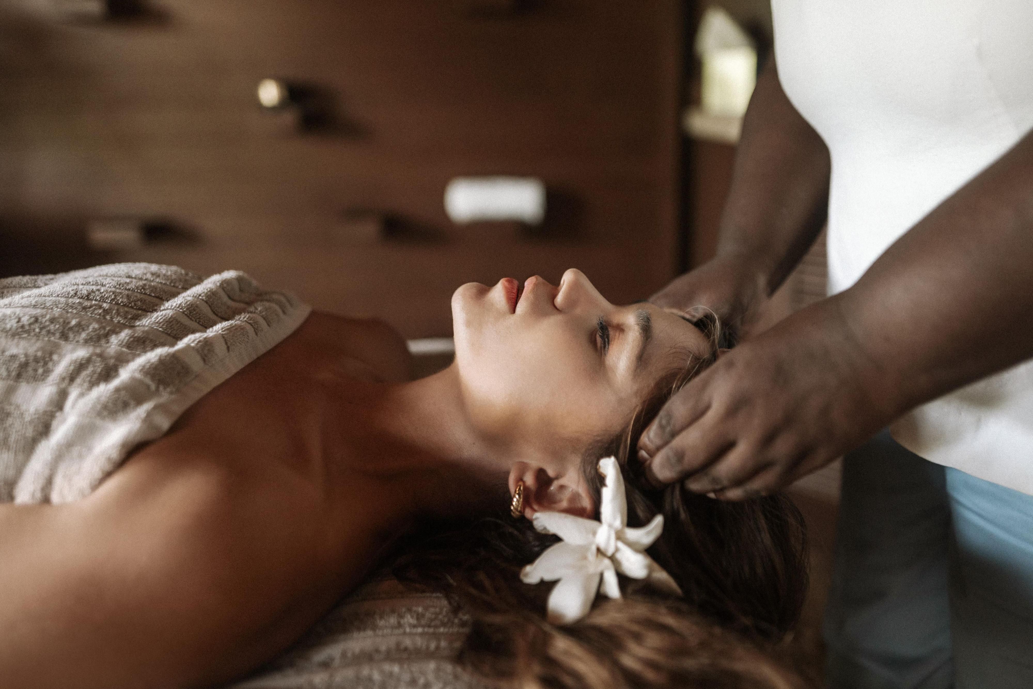 Women receiving a head massage in our Dominica Spa
