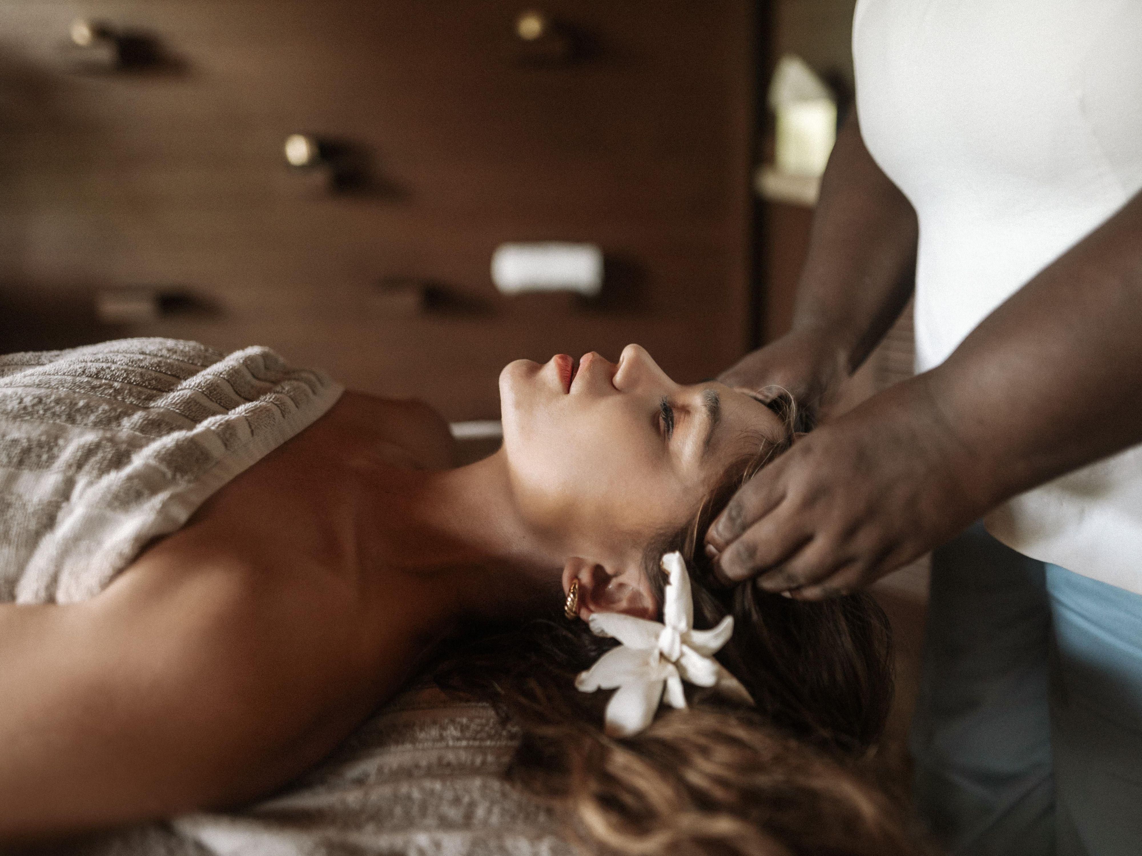 Women receiving a head massage in our Dominica Spa