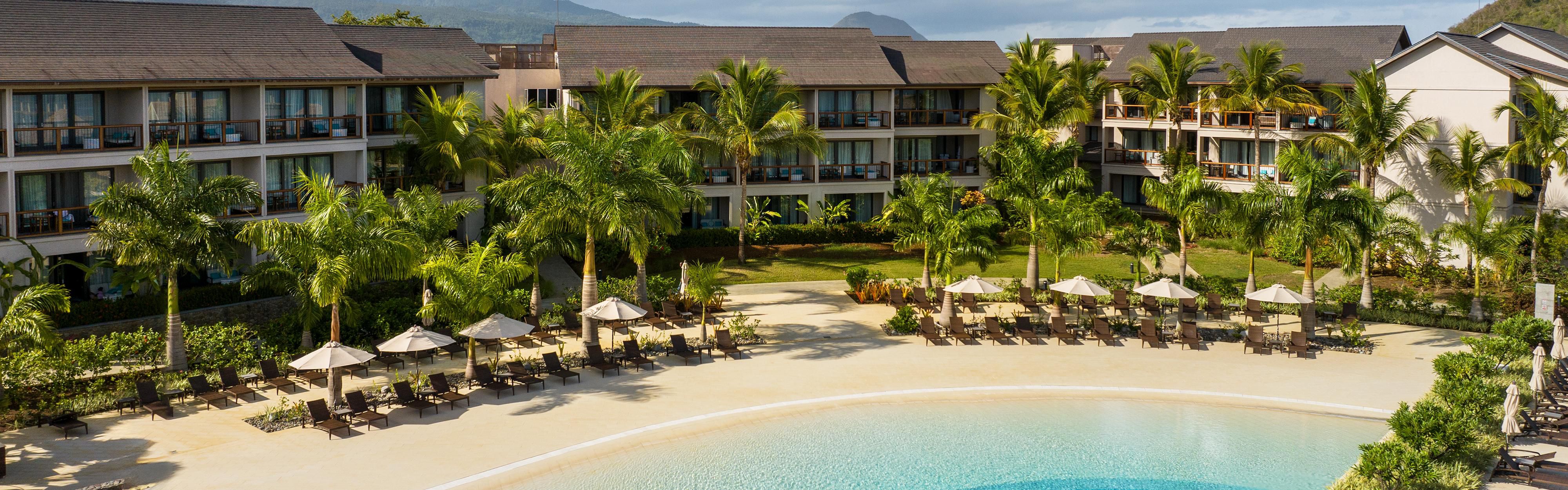 Drone photo of hotel exerior and luxury pool
