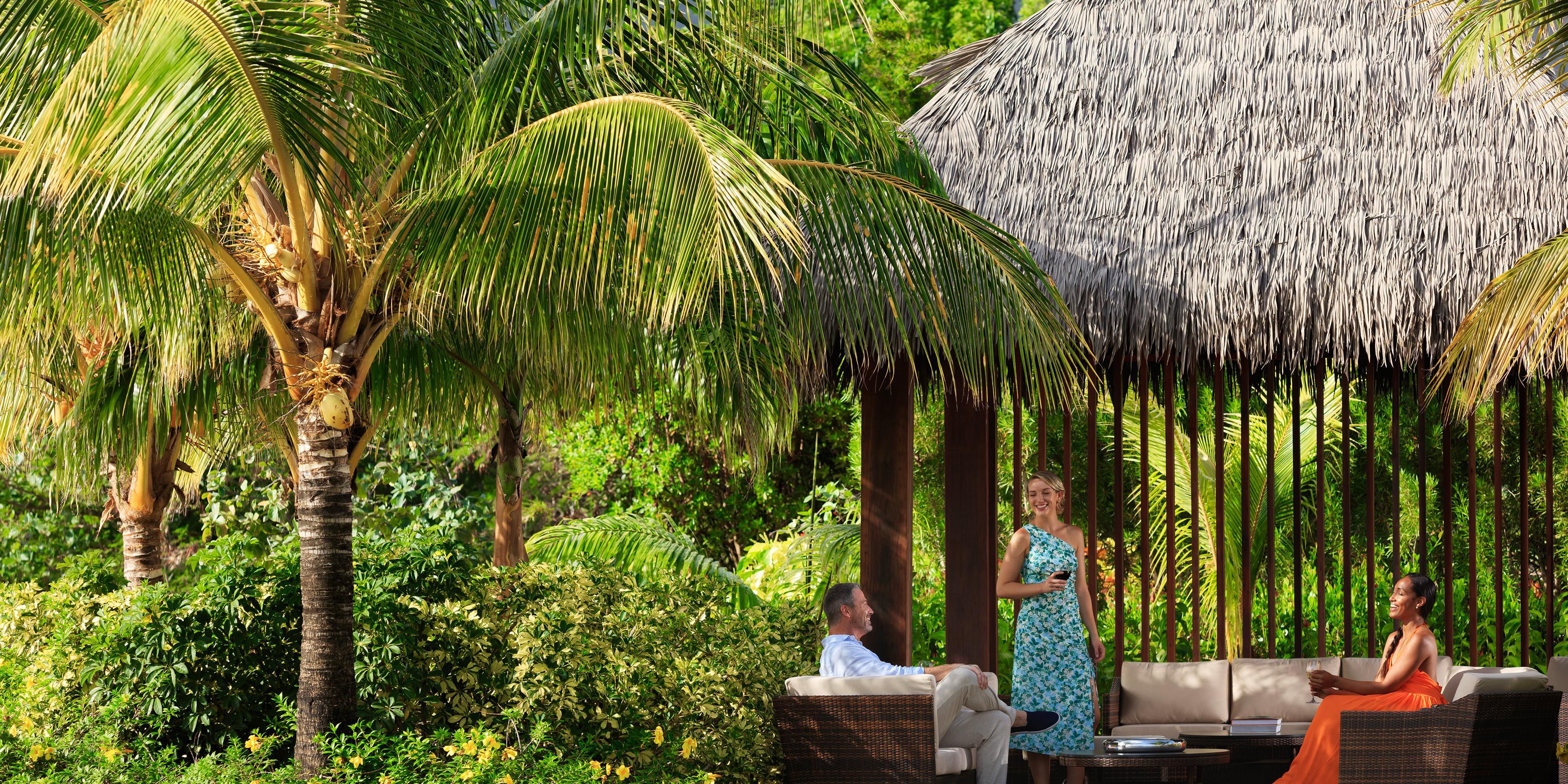 Guests enjoying a conversation at The Cabana Lawn.