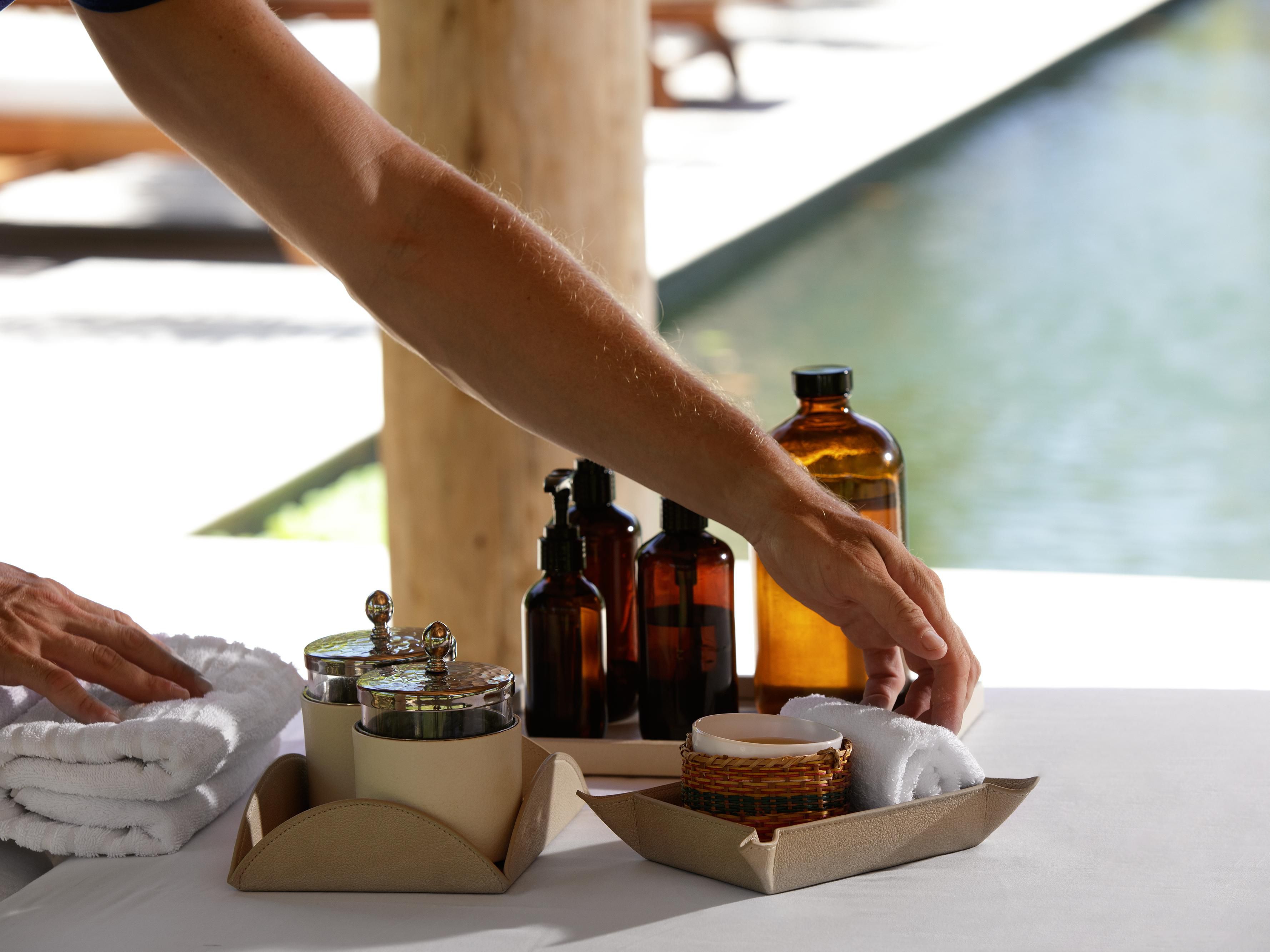 Spa products set out by pool