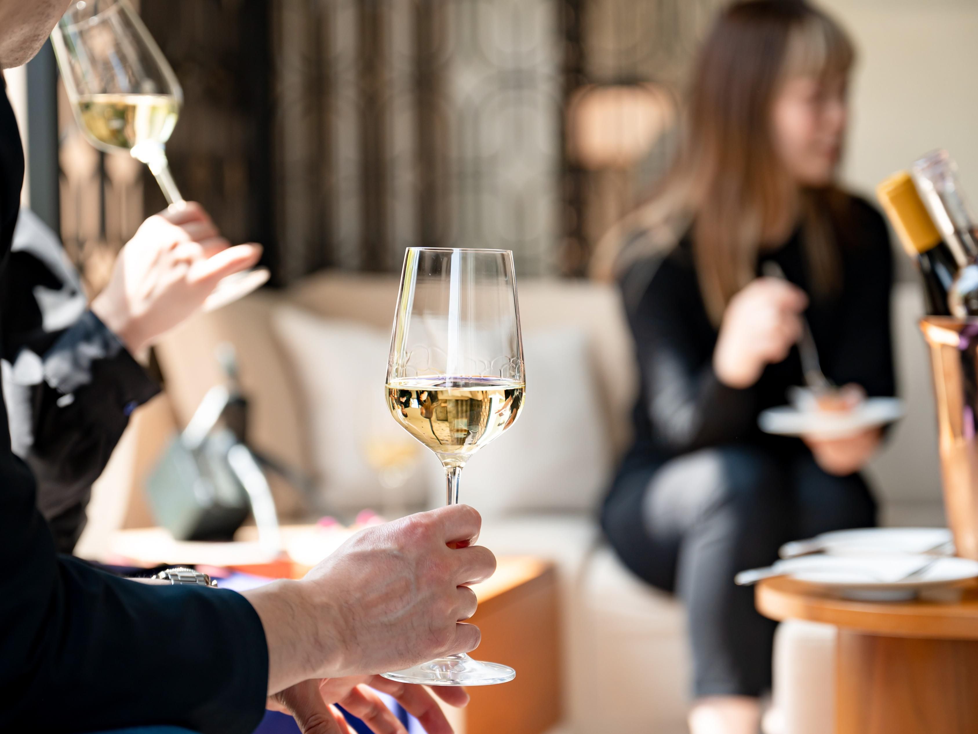 Group sitting around drinking wine