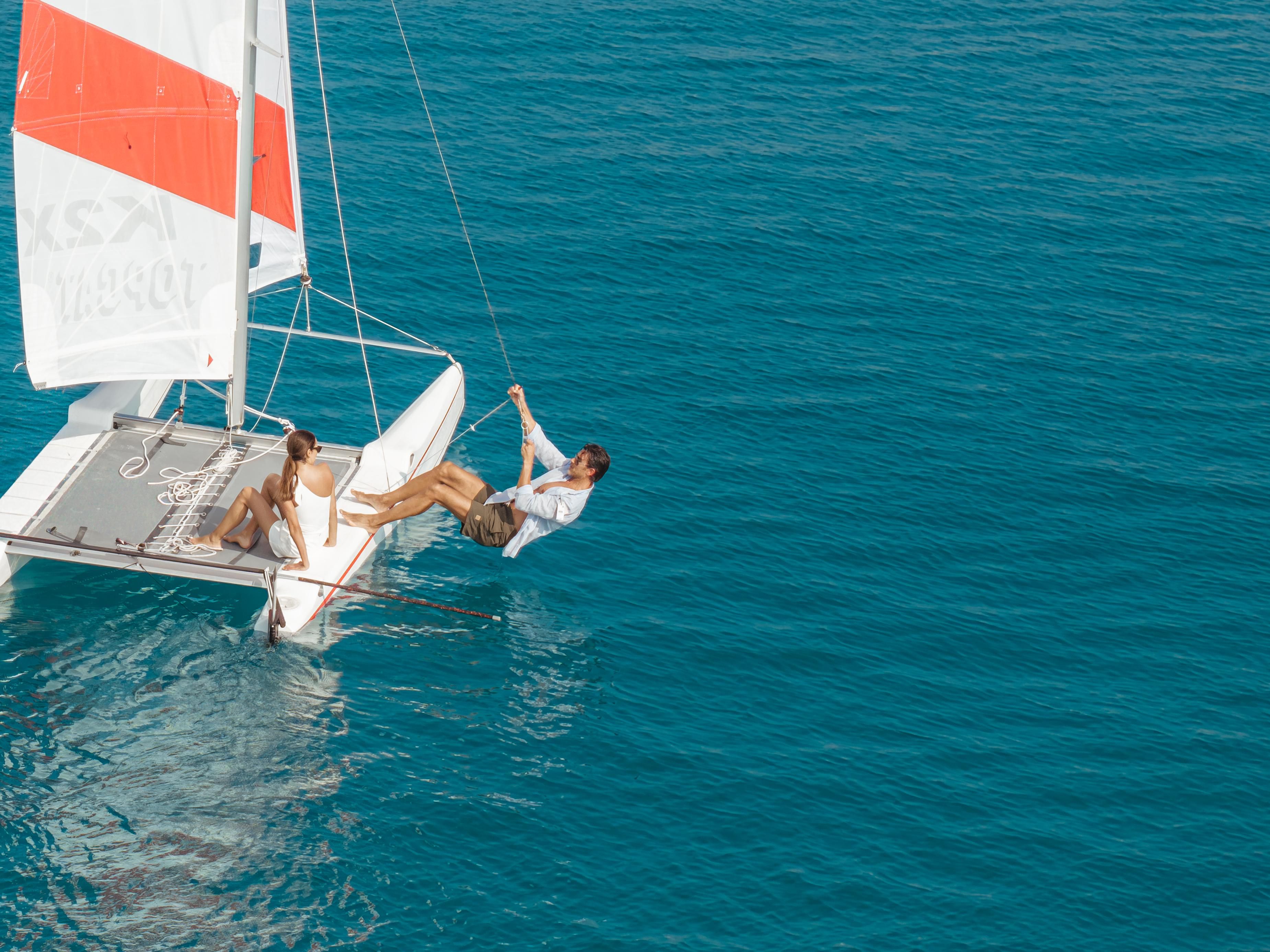 Catamaran Sailing Across Turquoise Maldivian Waters