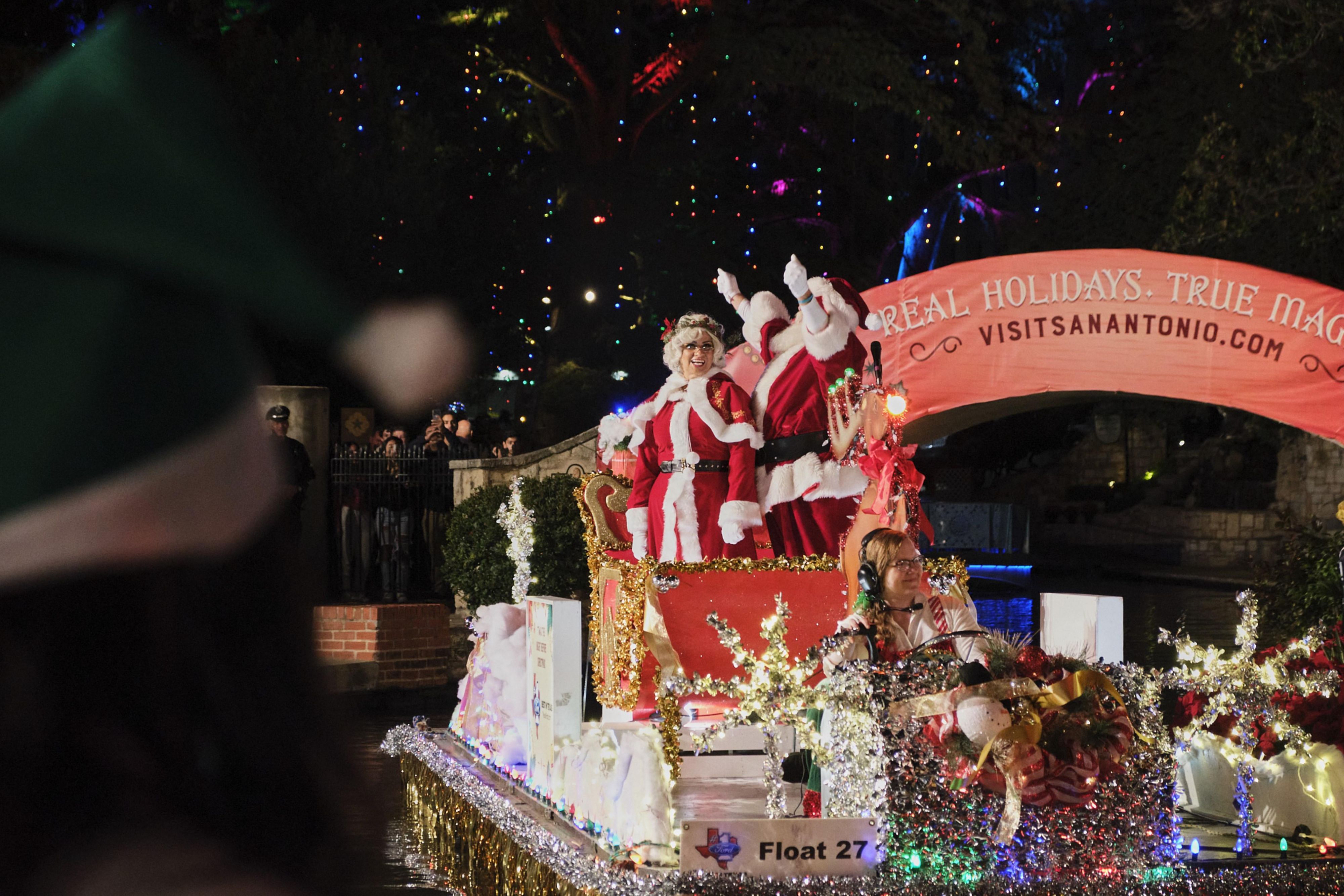 Mr. & Mrs. Claus on river float for parade