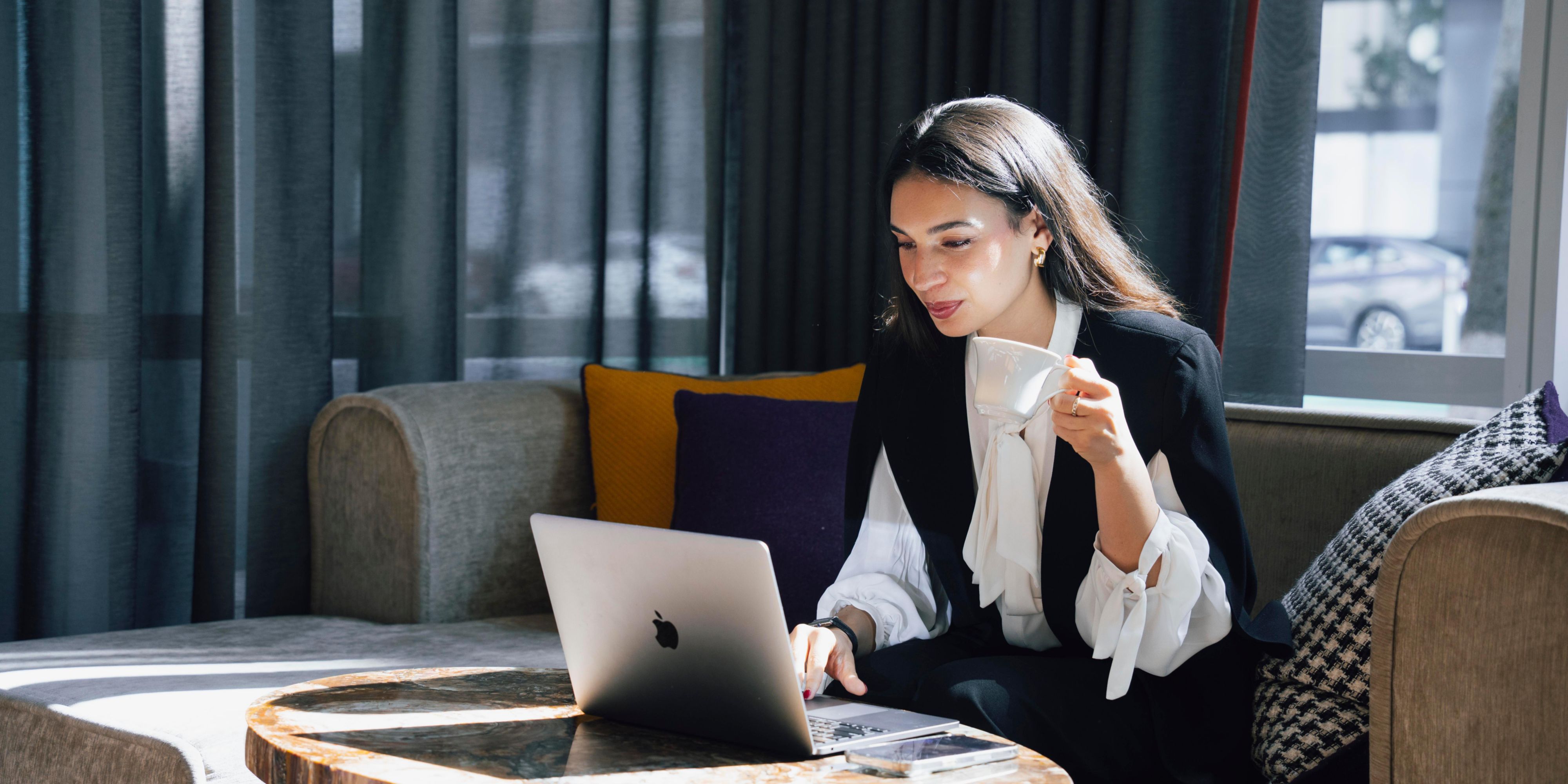 Woman working in hotel lobby