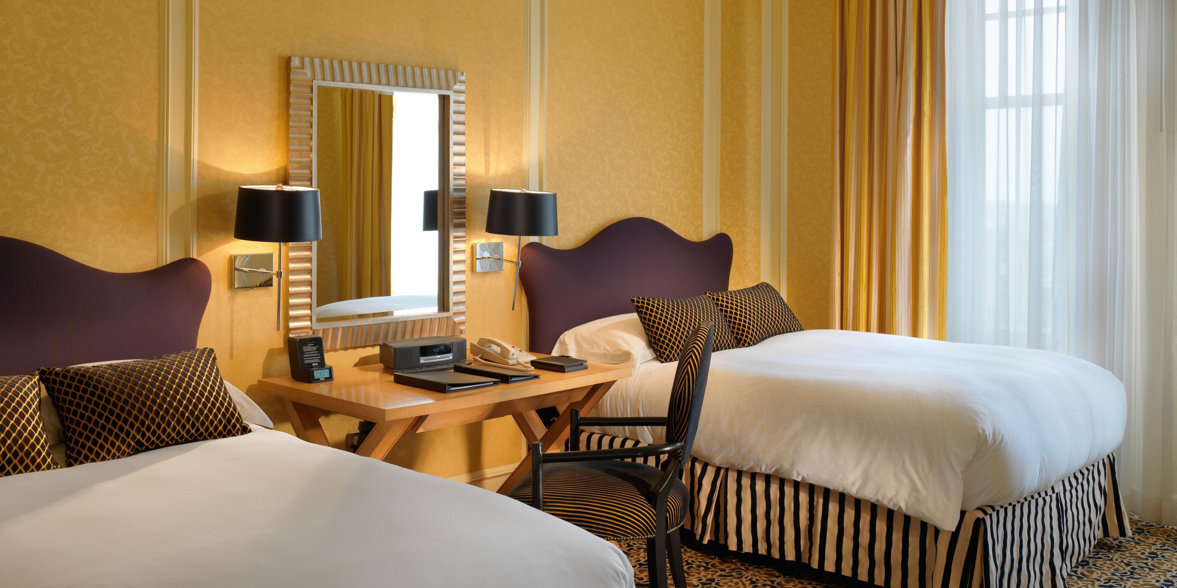 A second bedroom in the California Suite with 2 double beds