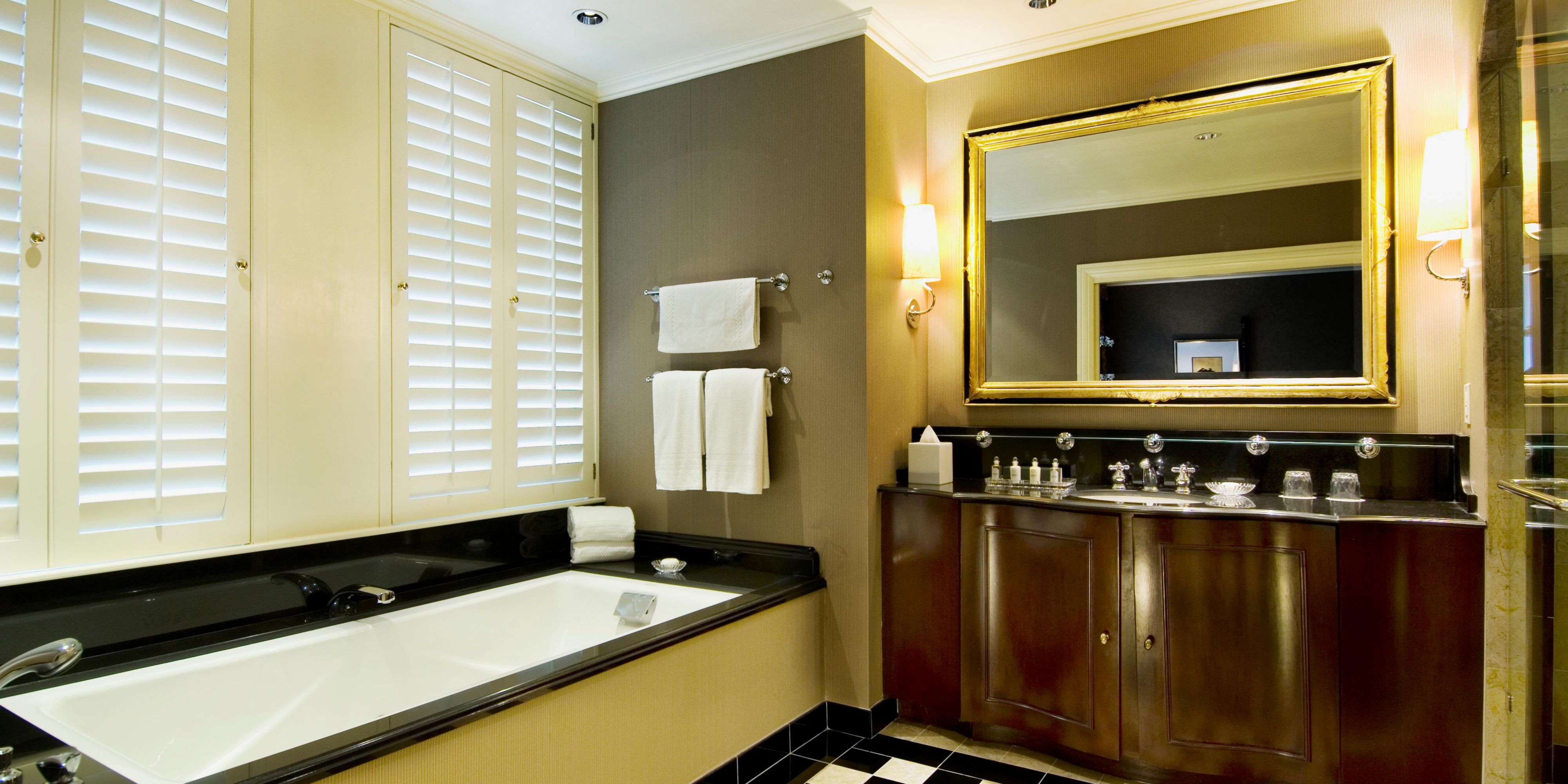 The luxurious bath with a unique checkerboard floor