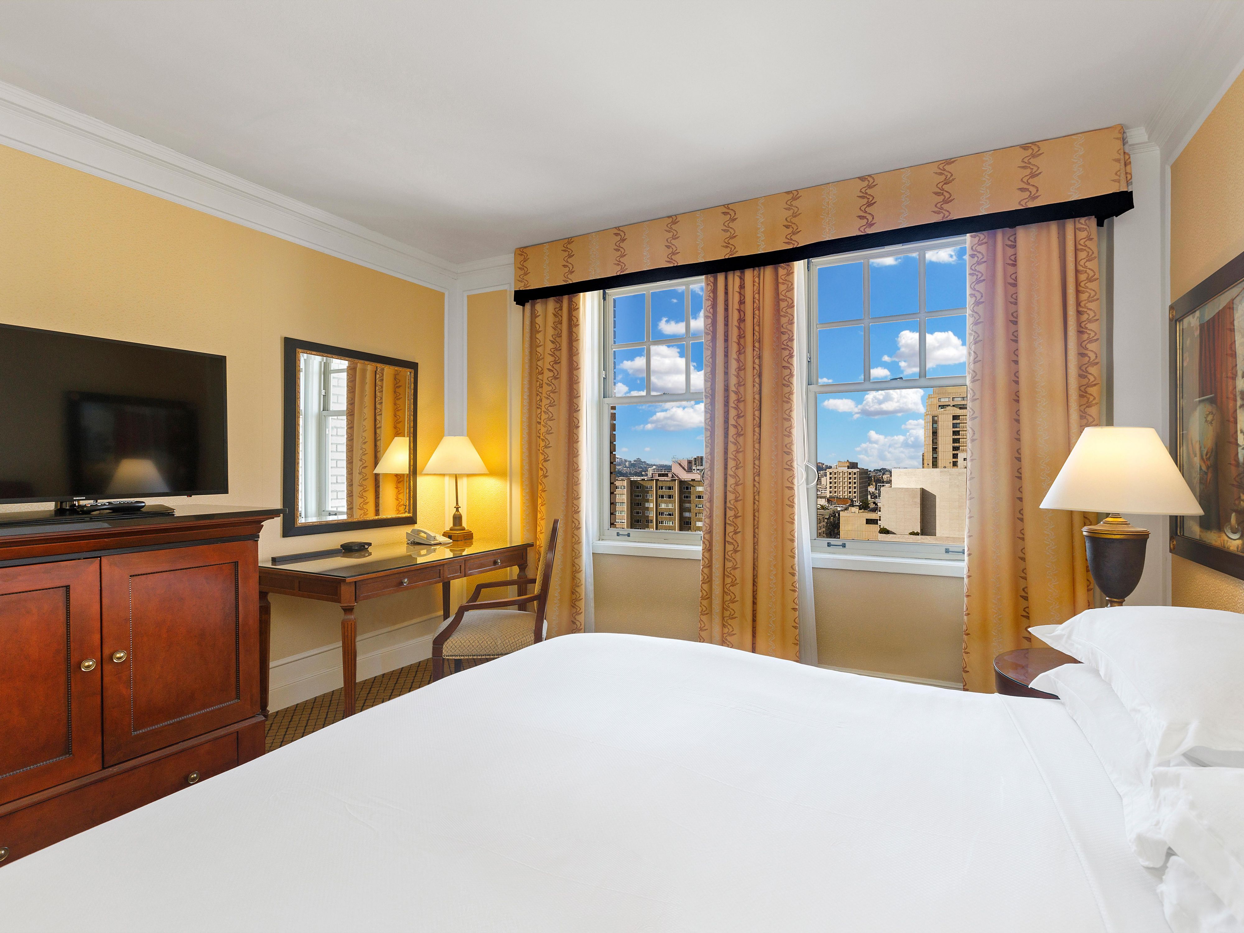 King-bedded room with mobility accessible tub.