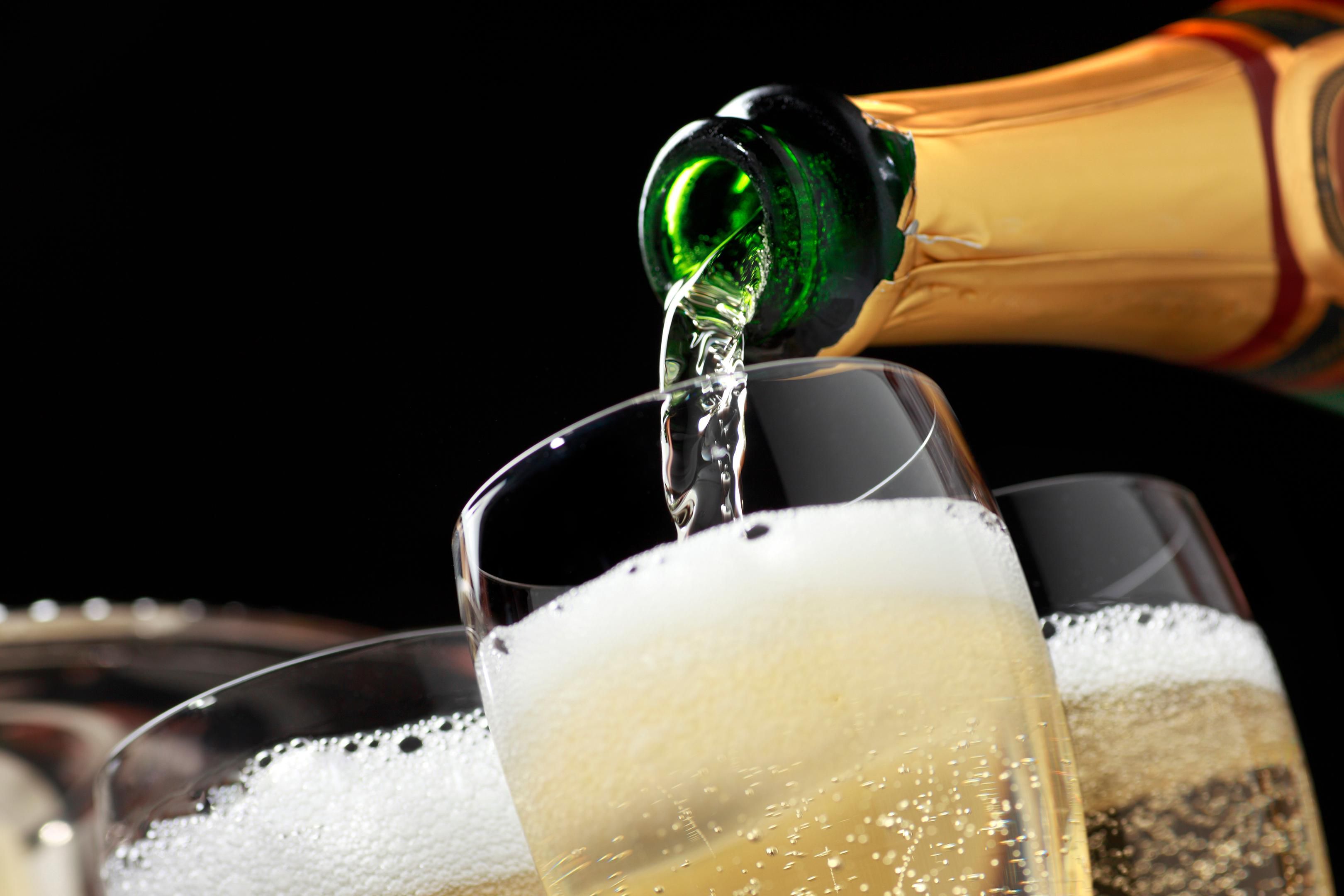 Champagne being poured into a glass.