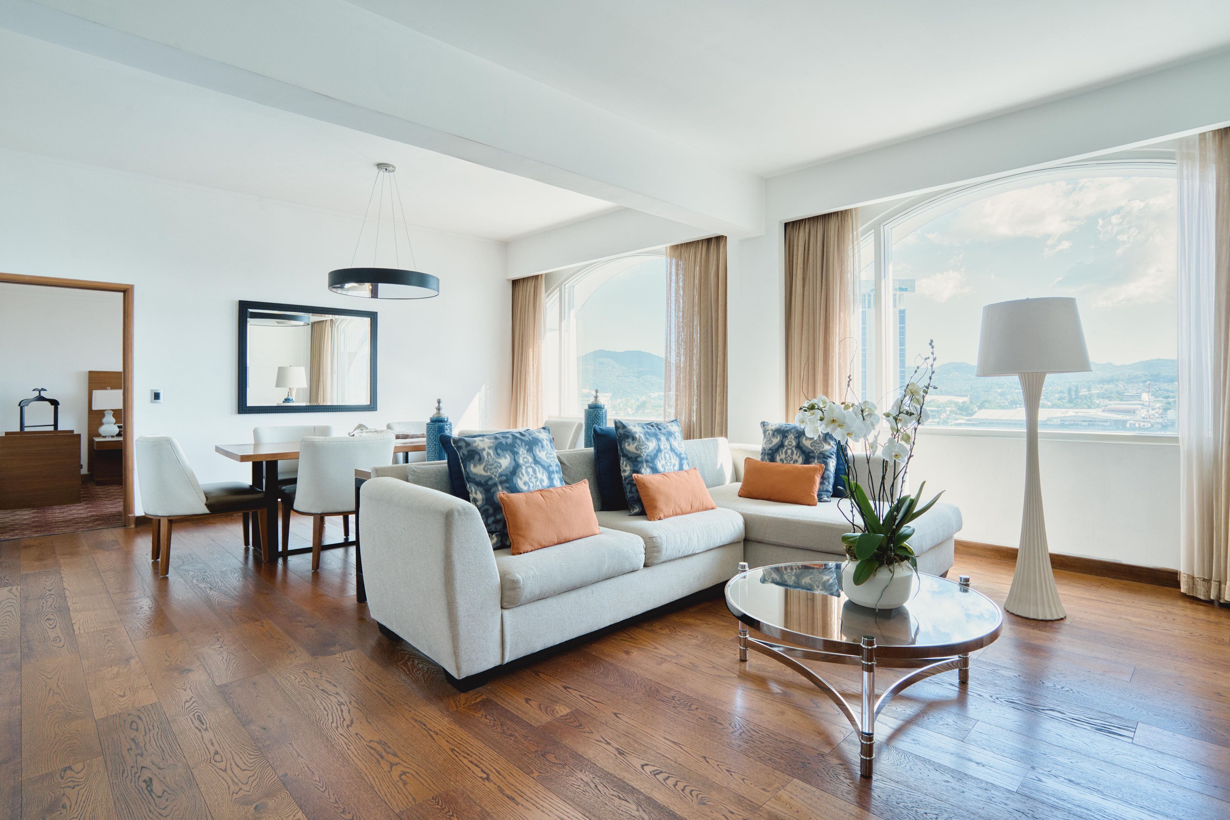 Luxurious presidential suite with elegant furnishings, and spacious living area.