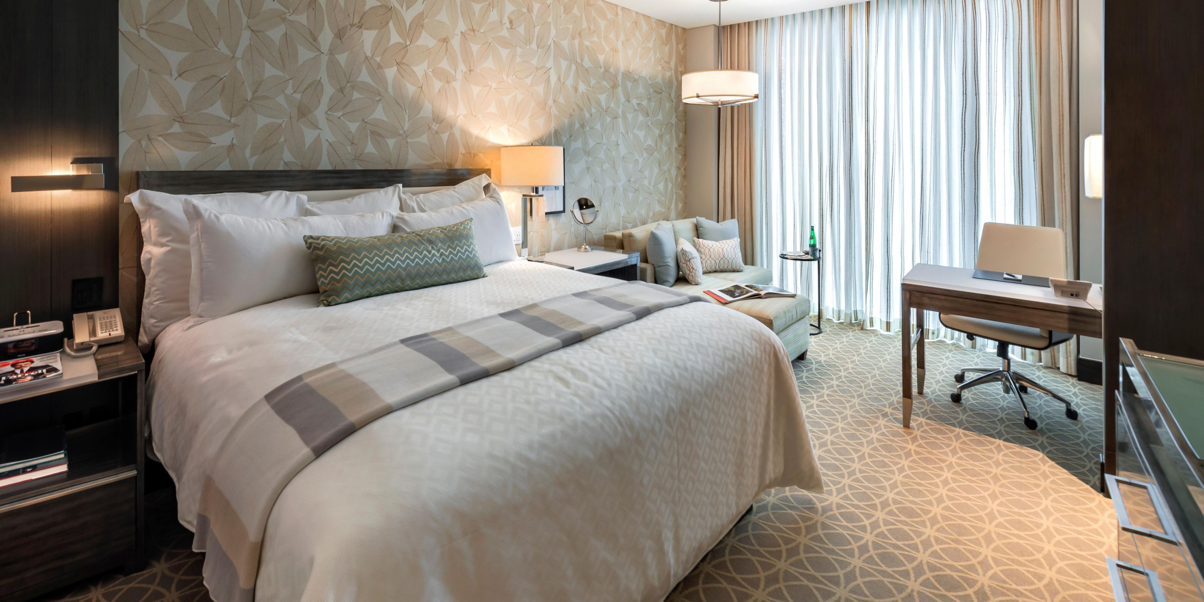 Experience luxury in our rooms and suites, where premium bedding, blackout curtains, and memory foam mattresses ensure a restful night's sleep. Enjoy free Wi-Fi with a dedicated router in every room. Refresh in lavish Victoria and Albert bathtubs and soak in stunning views of the ocean or city skyline. We blend comfort and sophistication.