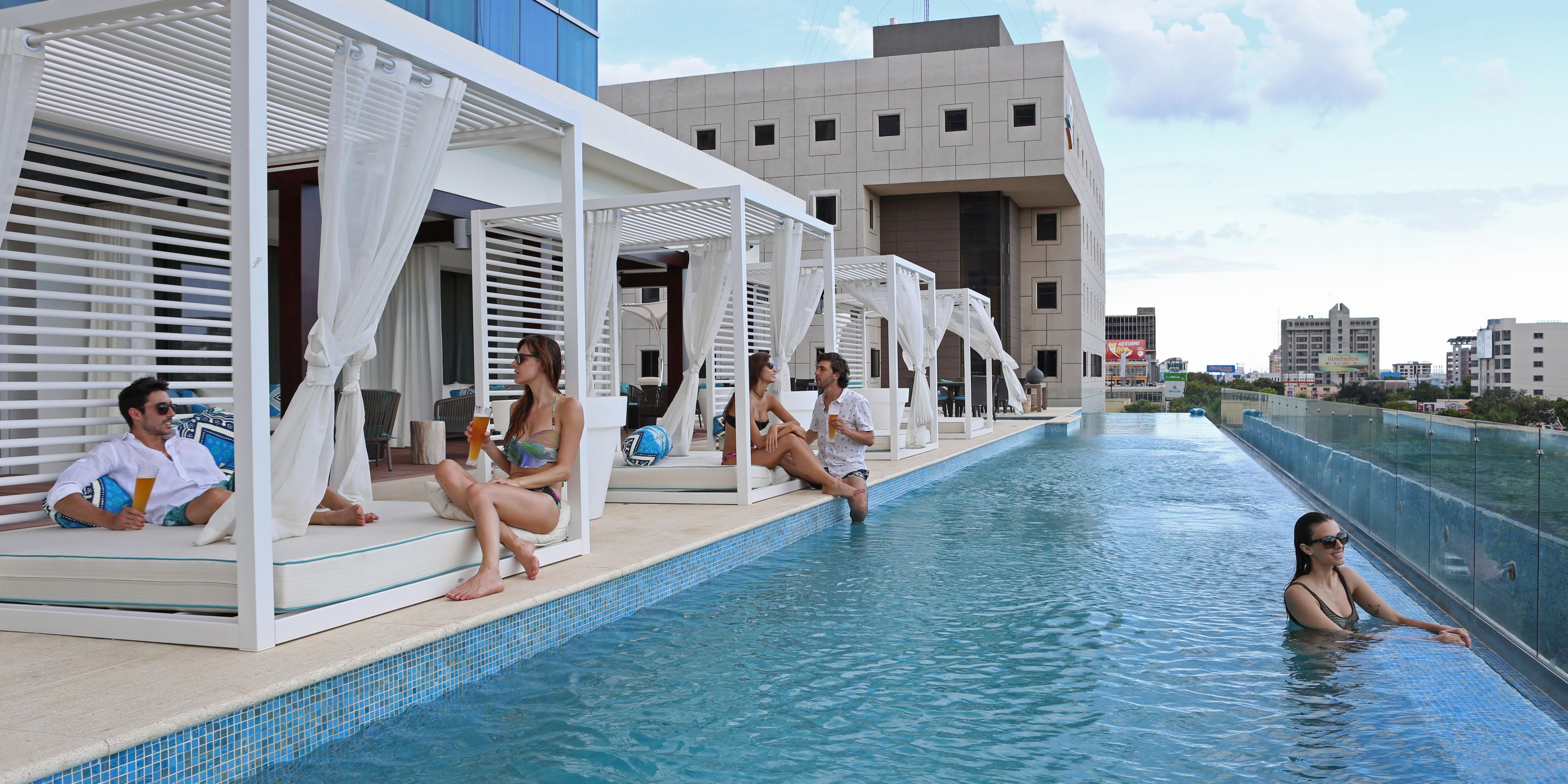 Relax in a poolside cabana with a cocktail from Blu Pool Bar