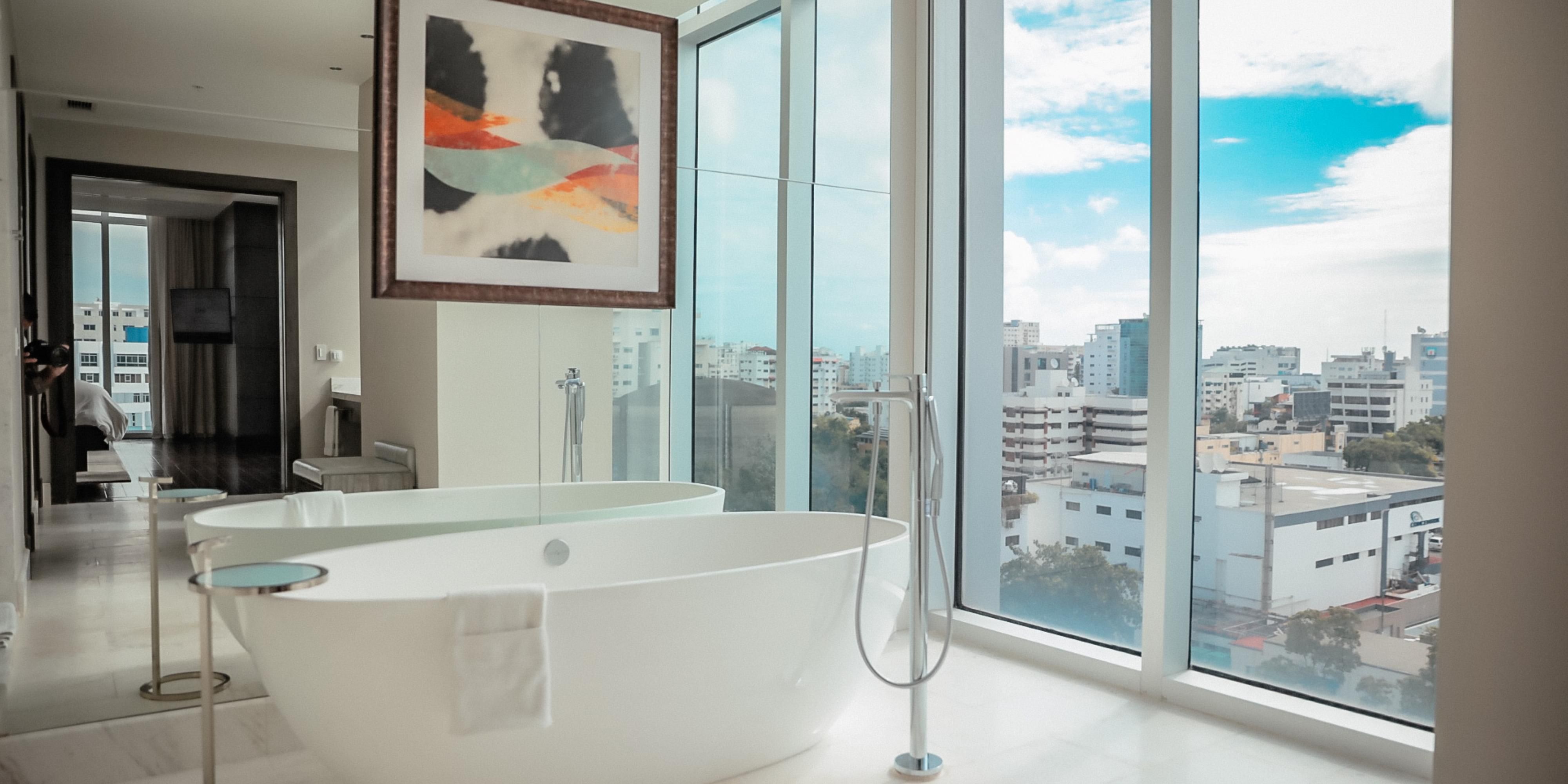 Experience luxury in our rooms and suites, where premium bedding, blackout curtains, and memory foam mattresses ensure a restful night's sleep. Enjoy free Wi-Fi with a dedicated router in every room. Refresh in lavish Victoria and Albert bathtubs and soak in stunning views of the ocean or city skyline. We blend comfort and sophistication.