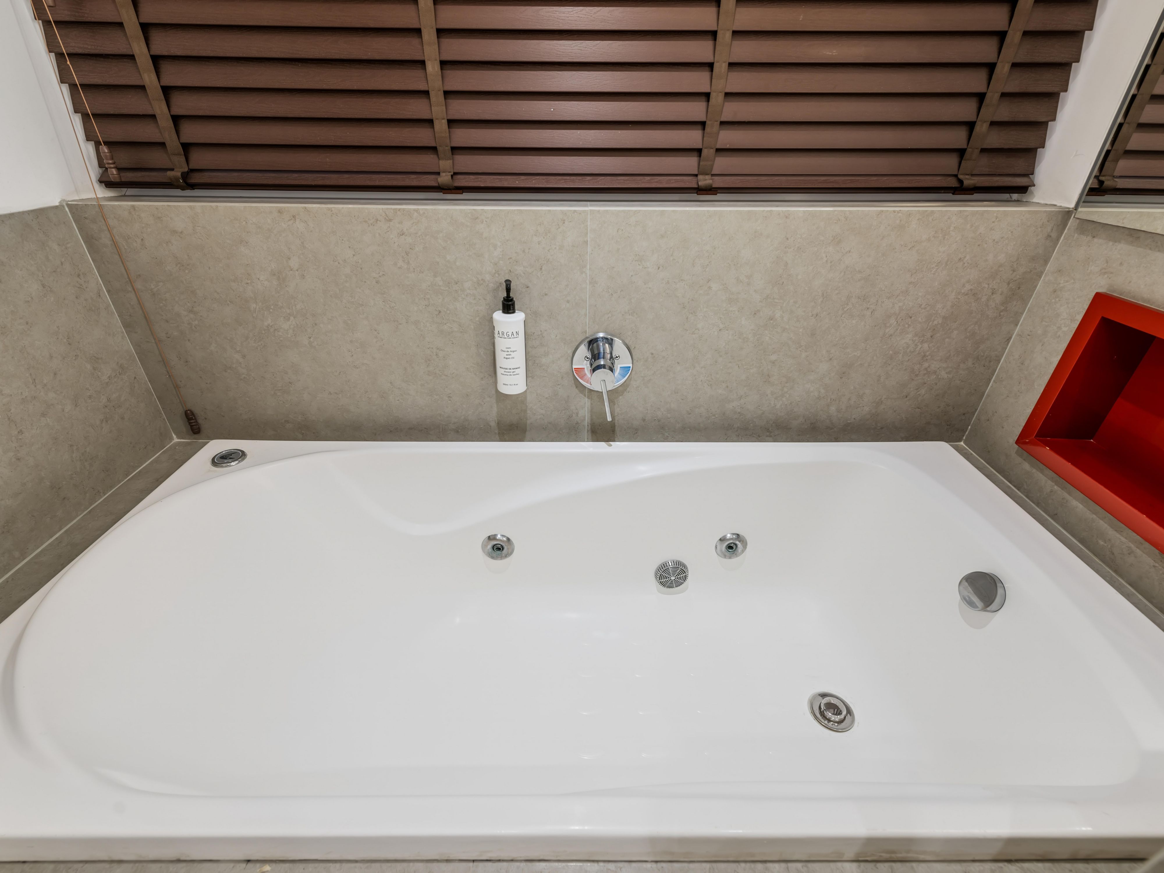 Relax in our cozy bathroom with a bathtub.