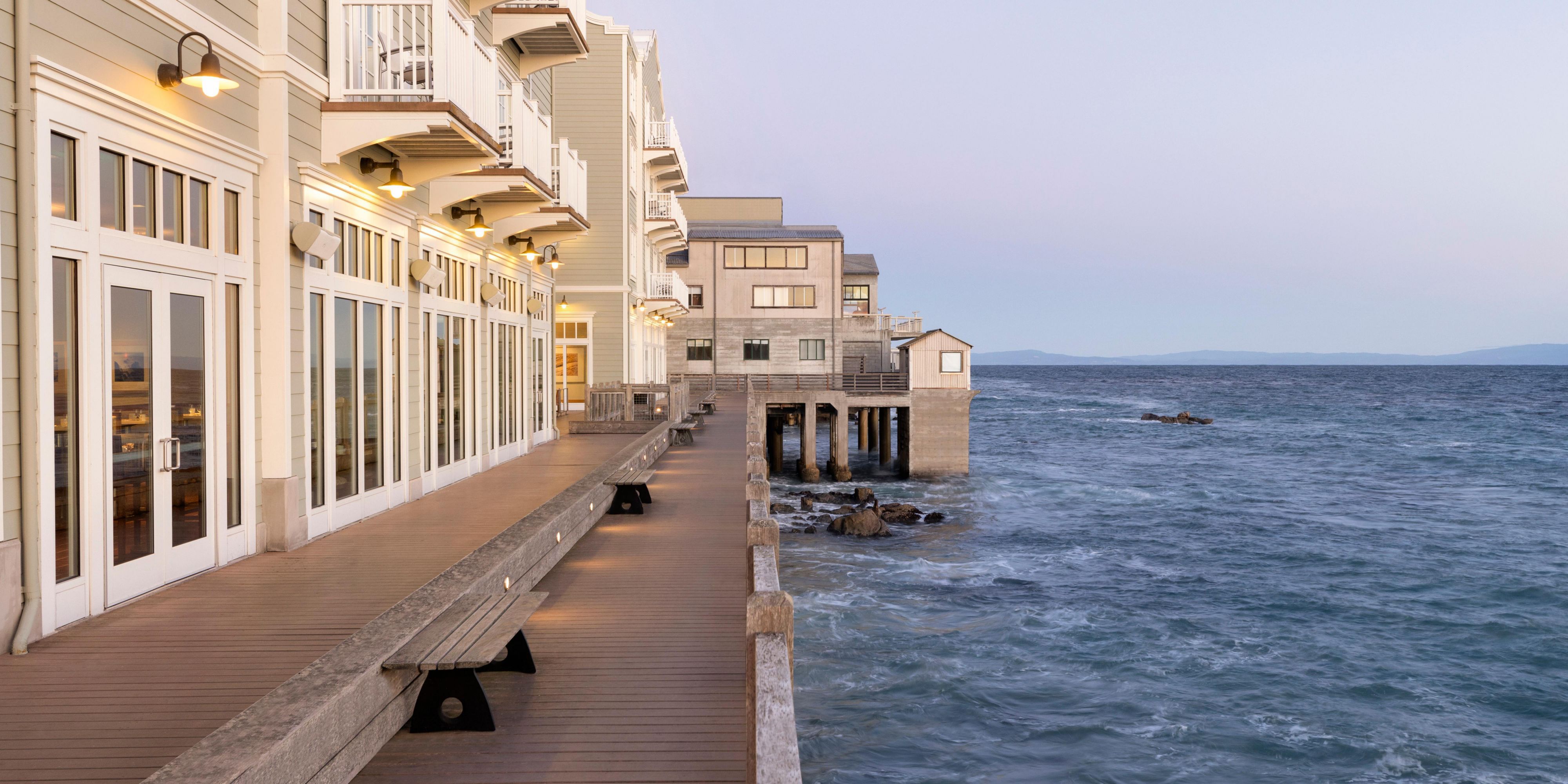 outdoor dining are next to ocean at night