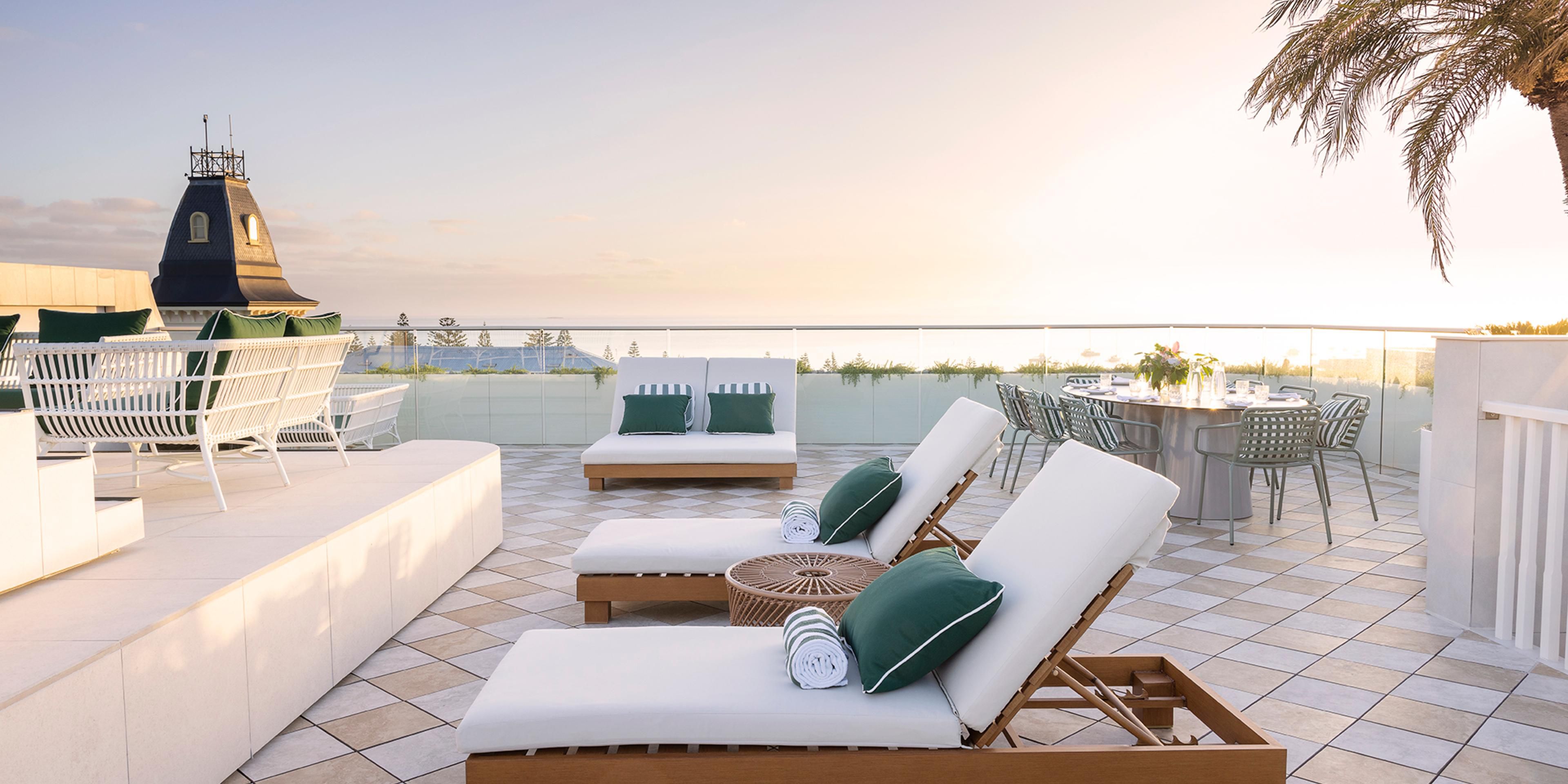 Immerse yourself in unparalleled coastal glamour. Spanning two storeys and a private rooftop terrace, our Penthouse Suites offer captivating bay views, a private plunge pool, and a separate lounge and dining area.