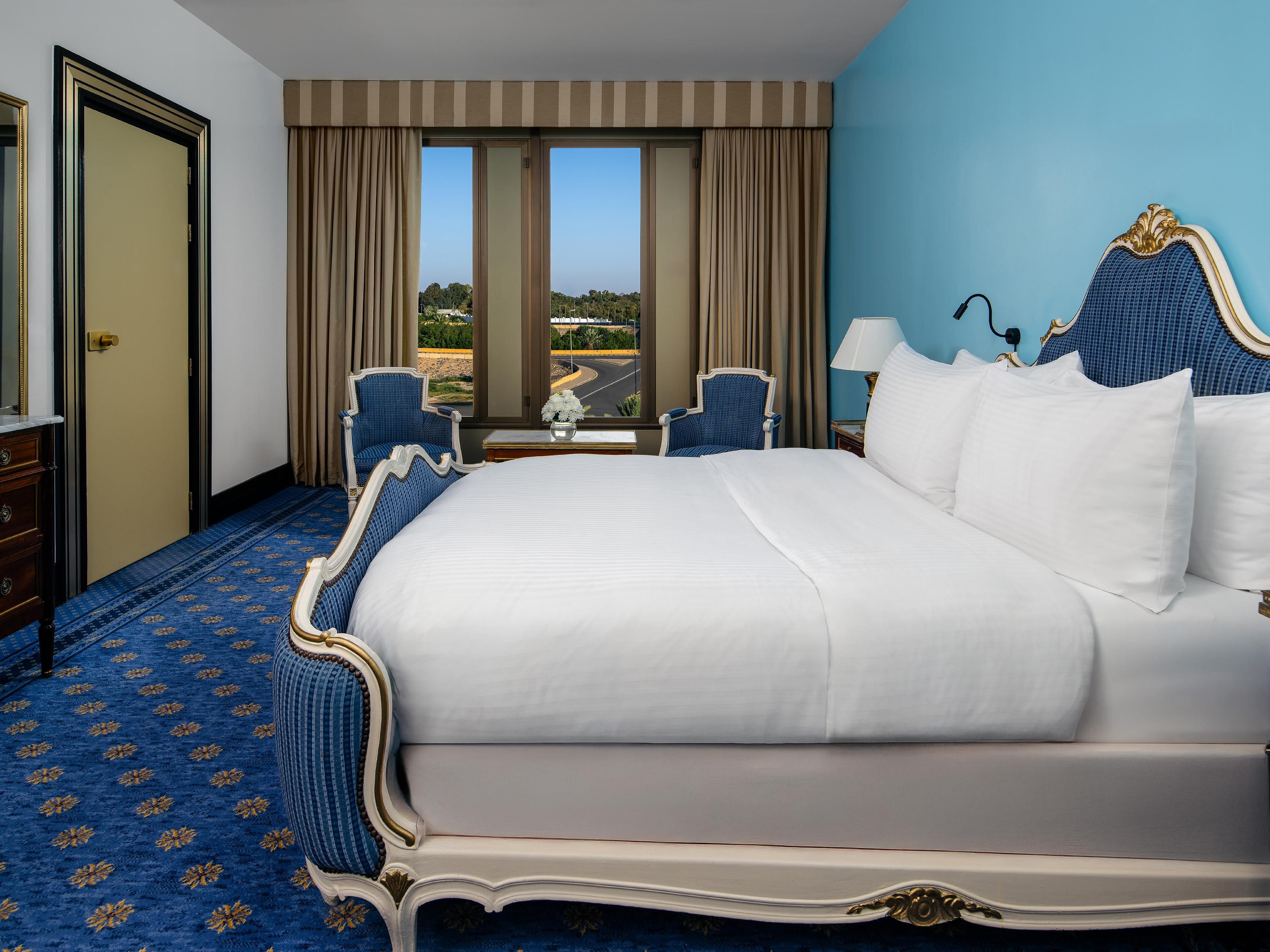 Relax in comfort and style in our cozy Queen Room bedroom