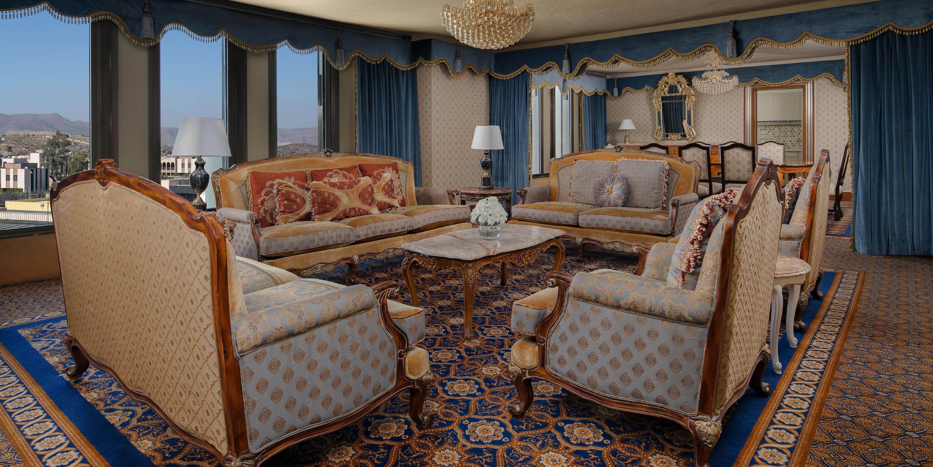 Relax in luxury in the spacious living area of the Royal Suite