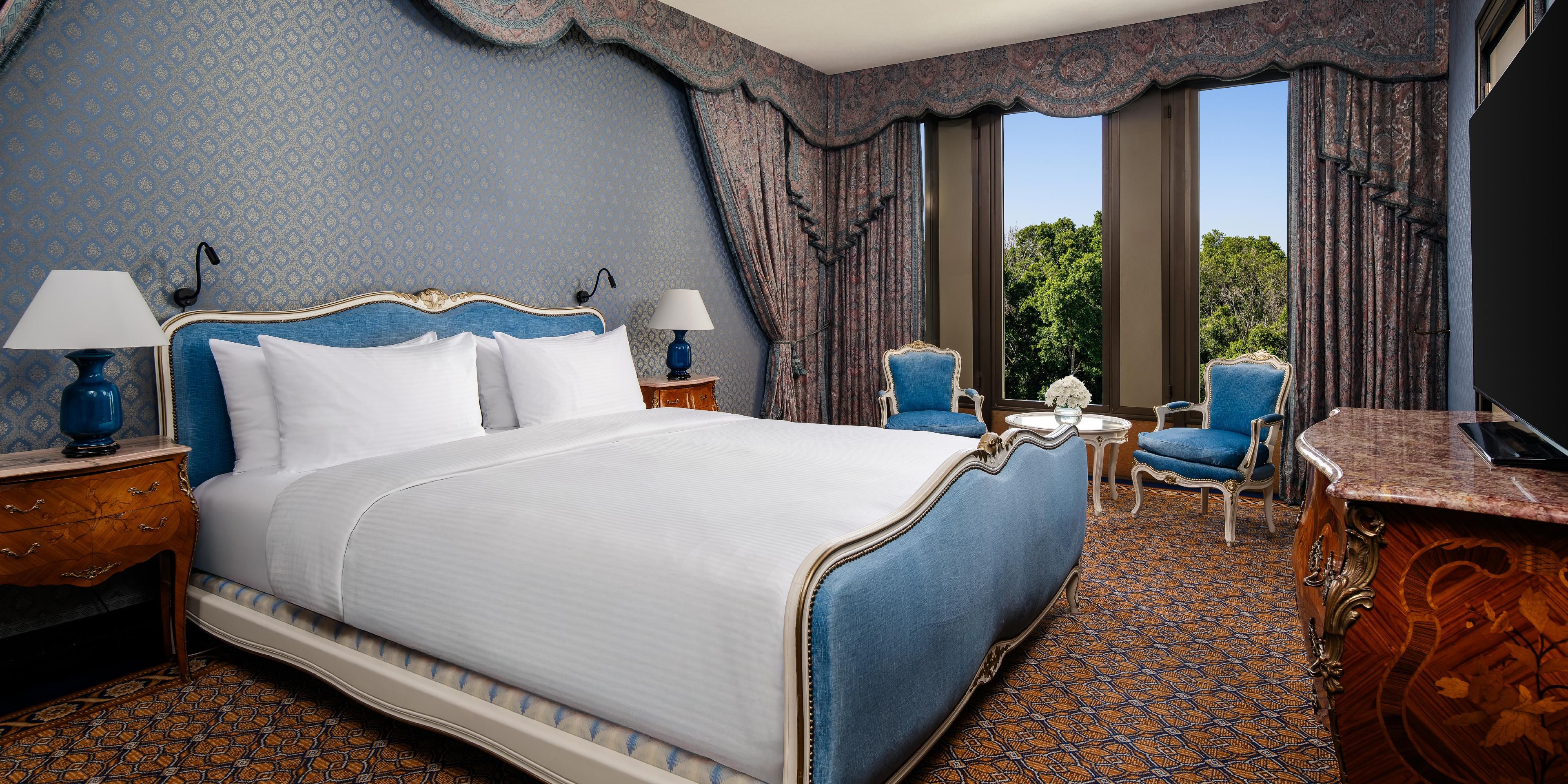Indulge in luxury and comfort in the Royal Suite bedroom