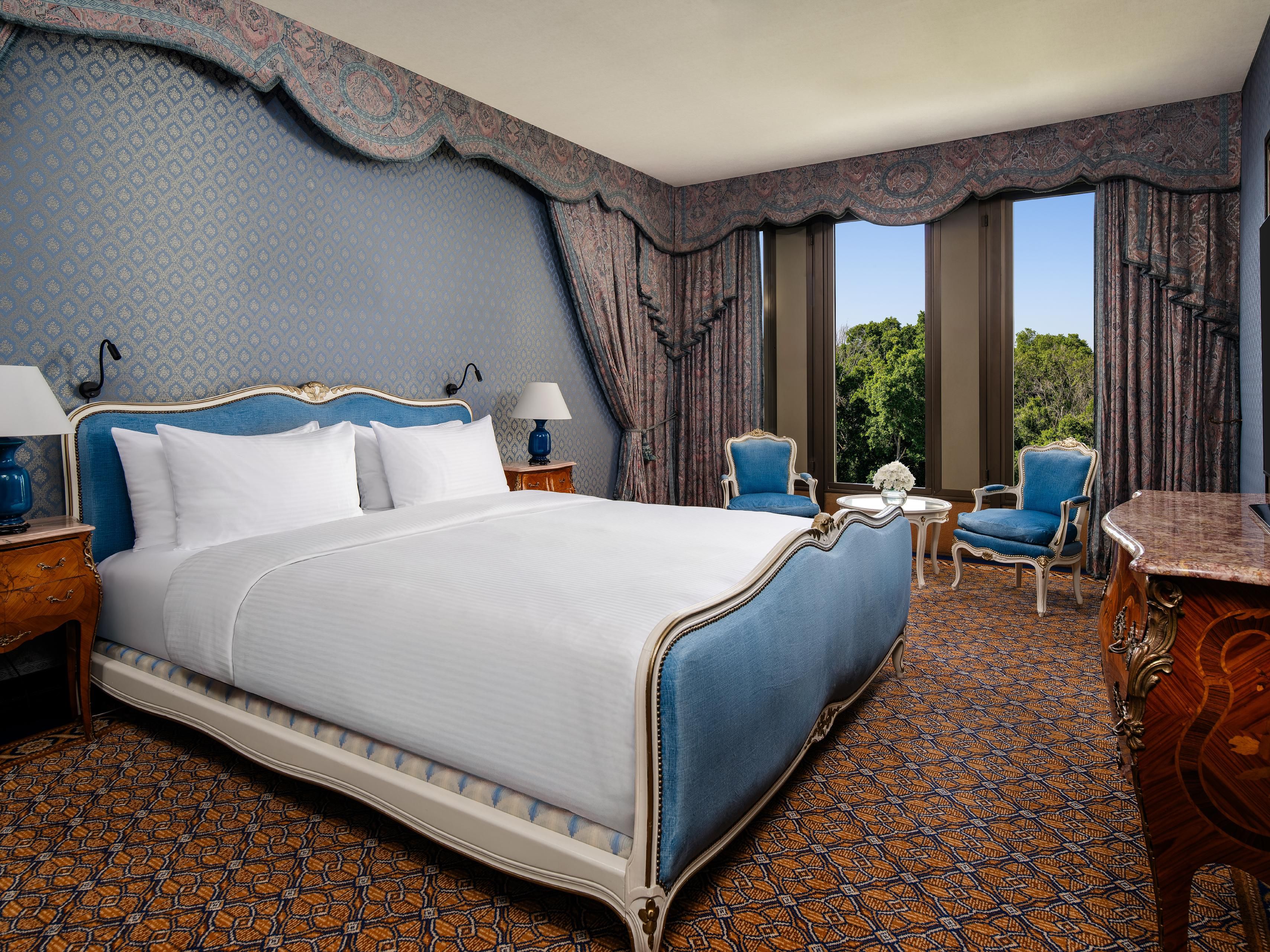 Indulge in luxury and comfort in the Royal Suite bedroom