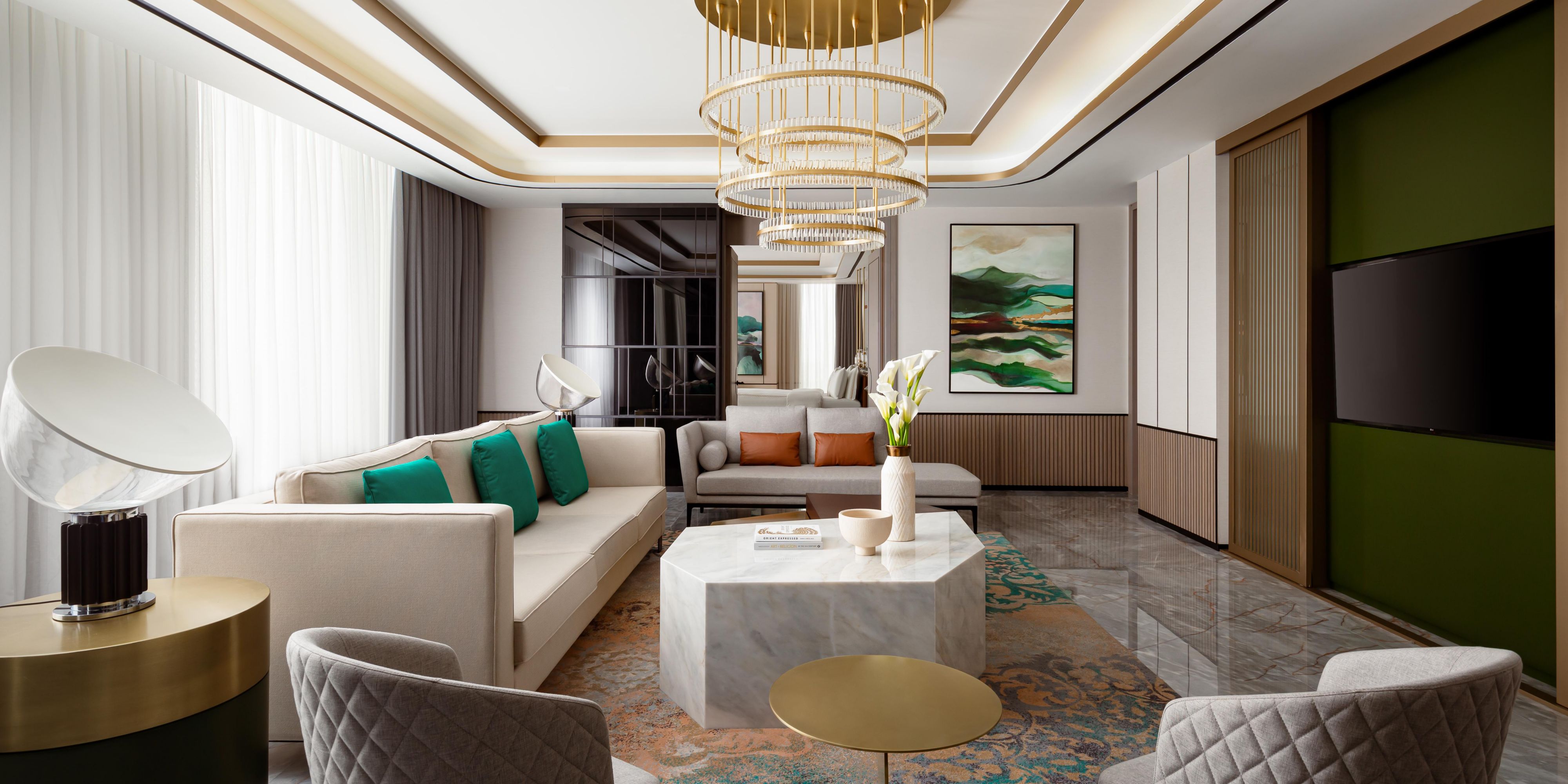 The green and soft beige interior of Modern Presidential Suite.