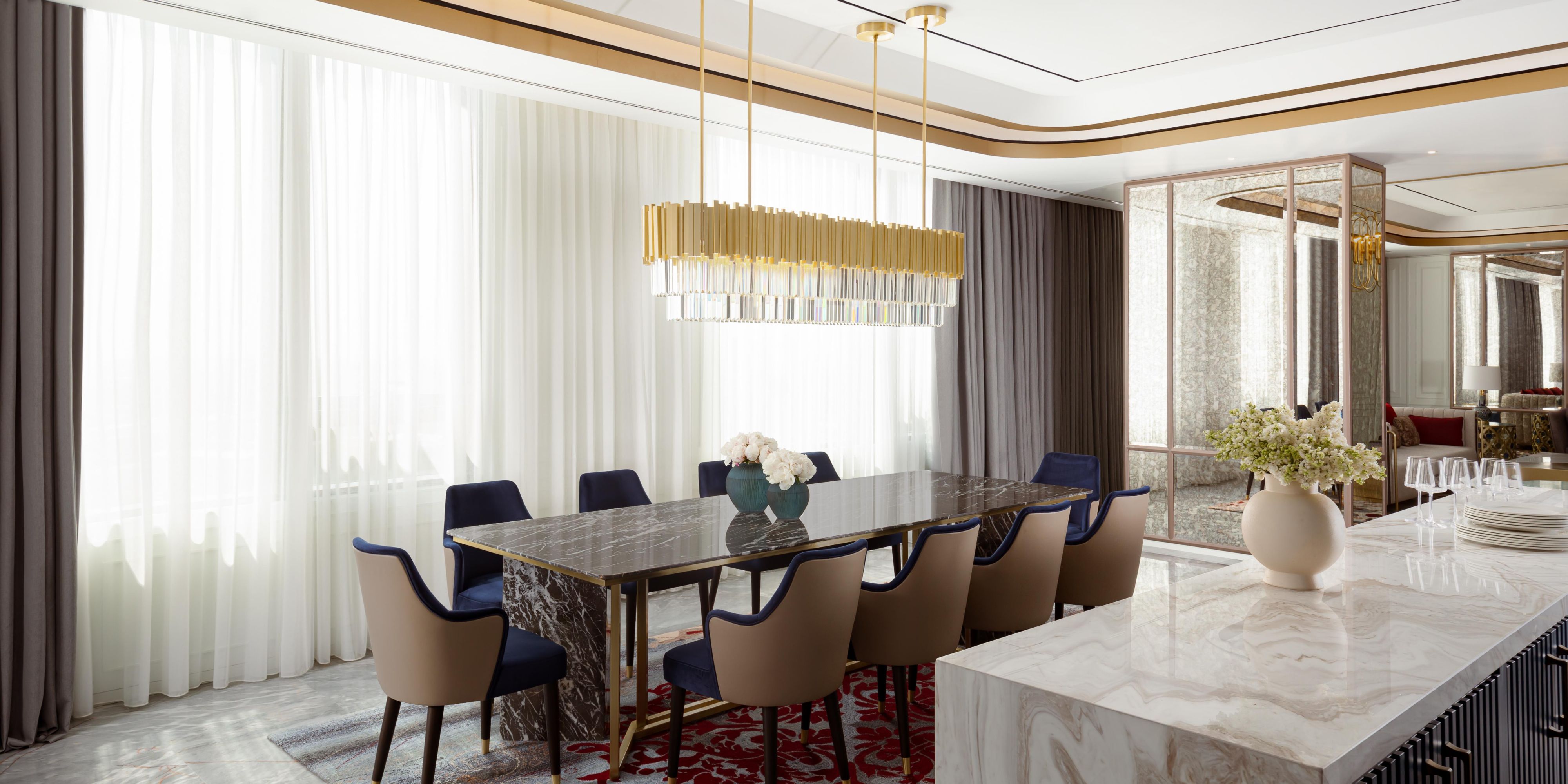 A stylish 10-person dining area in Presidential Suite. 