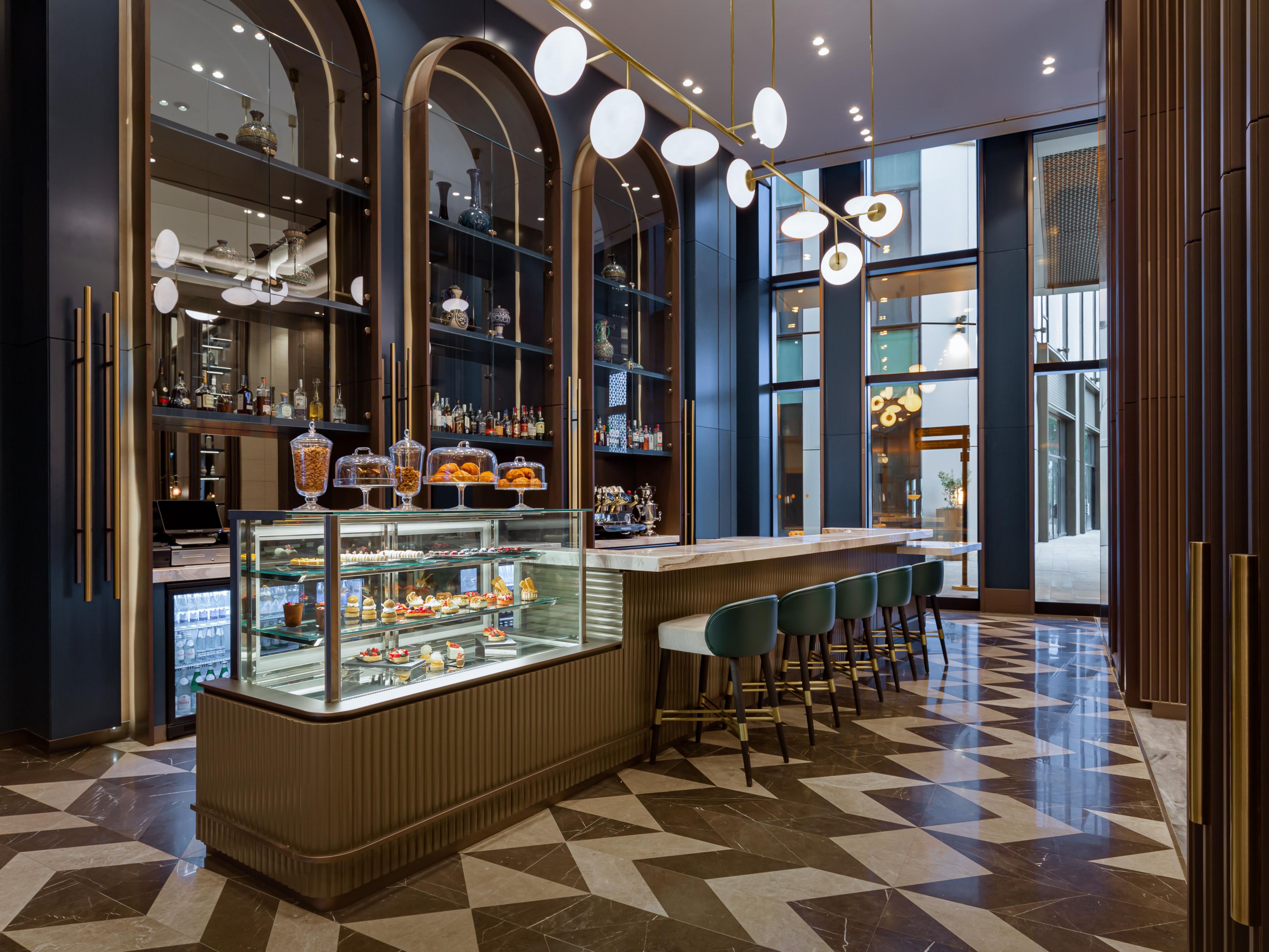 The vitrine in Chach displays fresh patisserie and desserts.