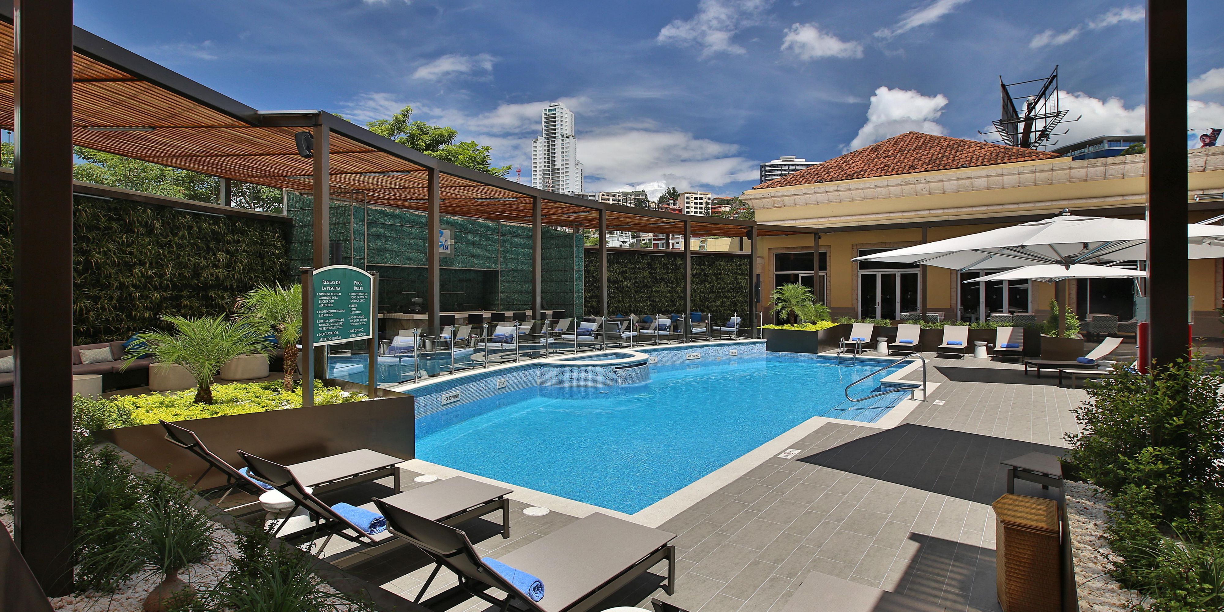 Bask in the radiant sunshine of Tegucigalpa at our stunning pool. Our day pass, available every day from 9 AM to 5 PM, invites you and up to three companions to unwind in a tranquil setting. Experience the elegance and comfort that define your stay with us.