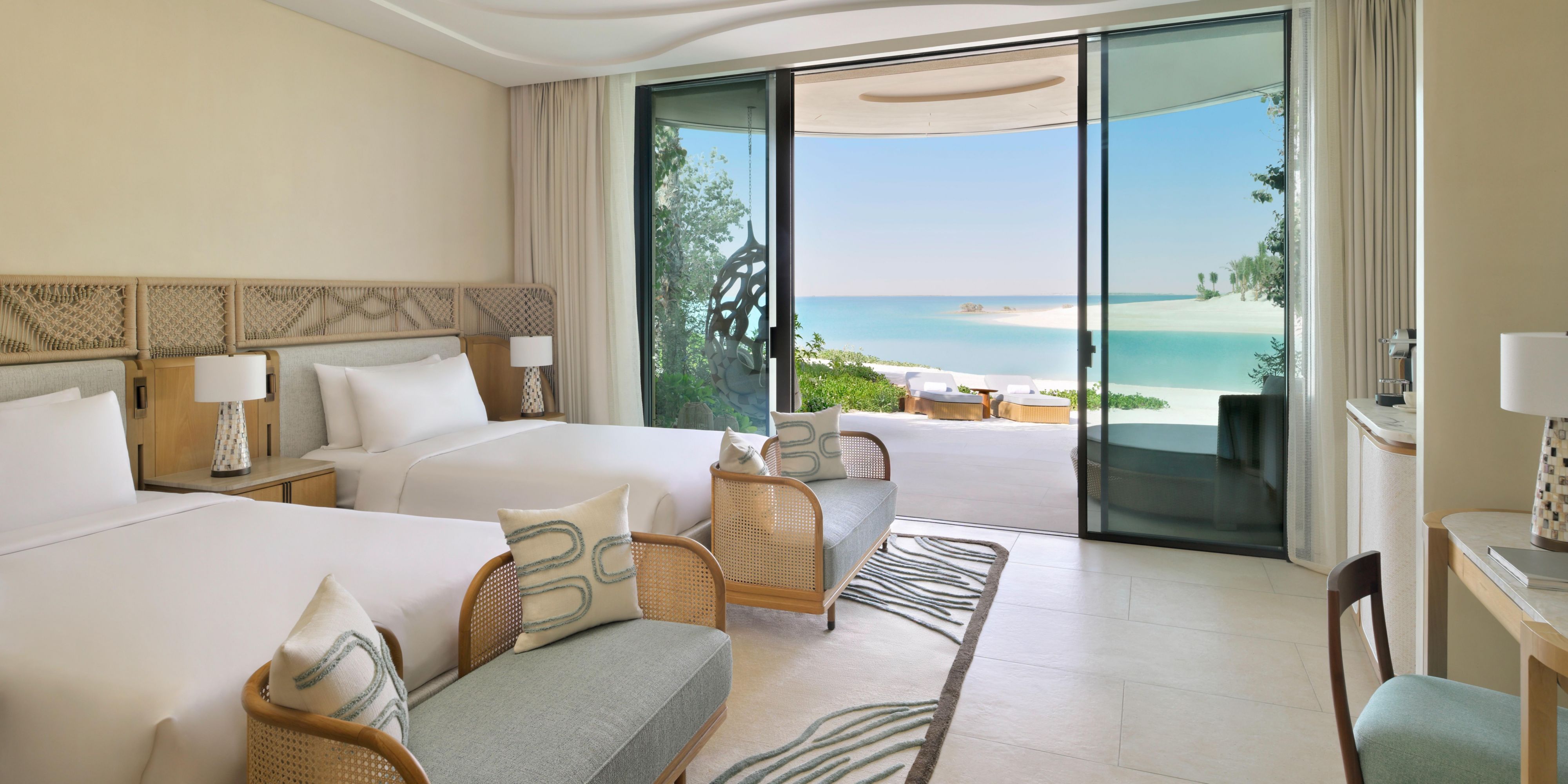 Spacious twin room with breezy beachfront views