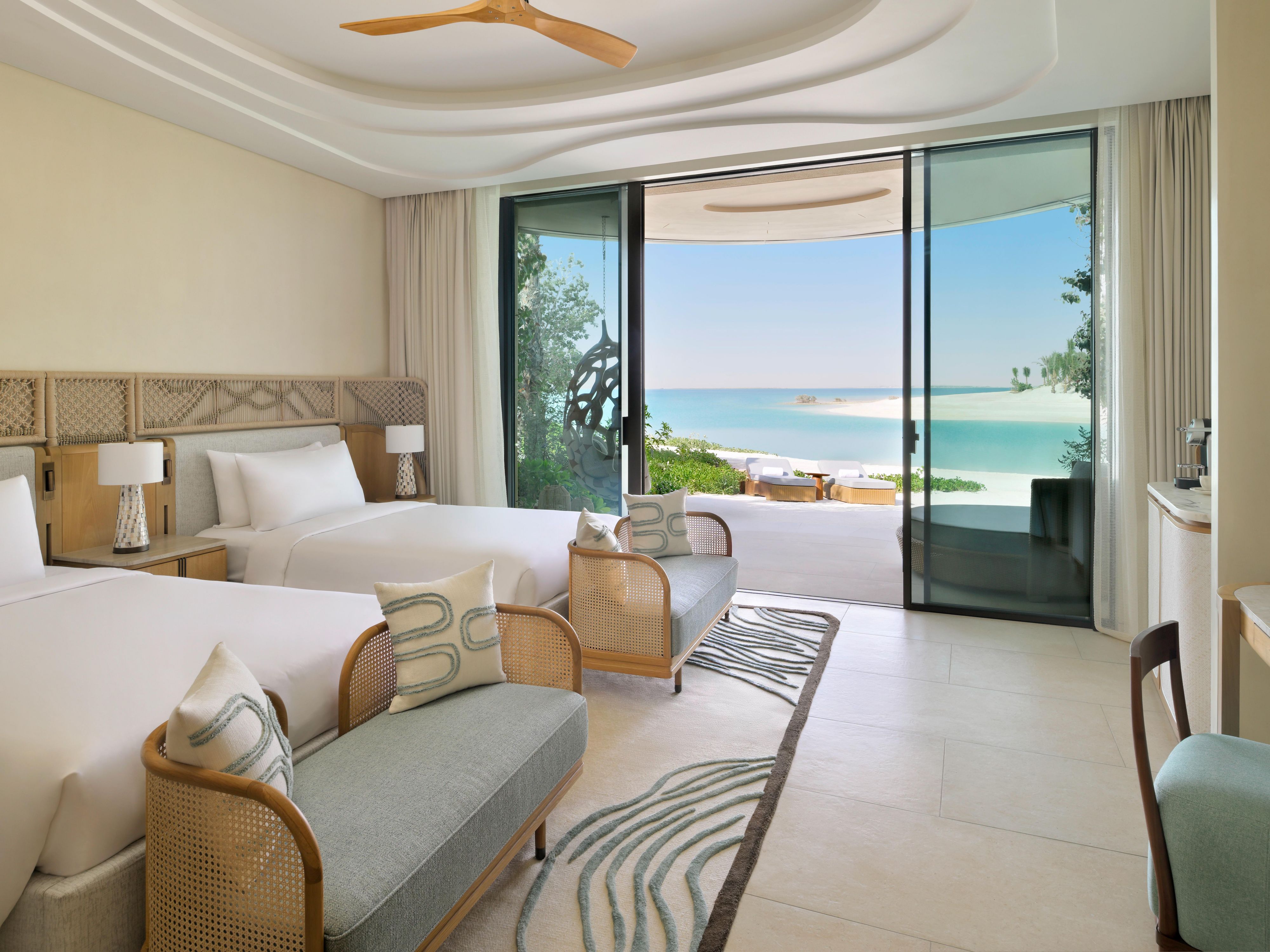 Spacious twin room with breezy beachfront views