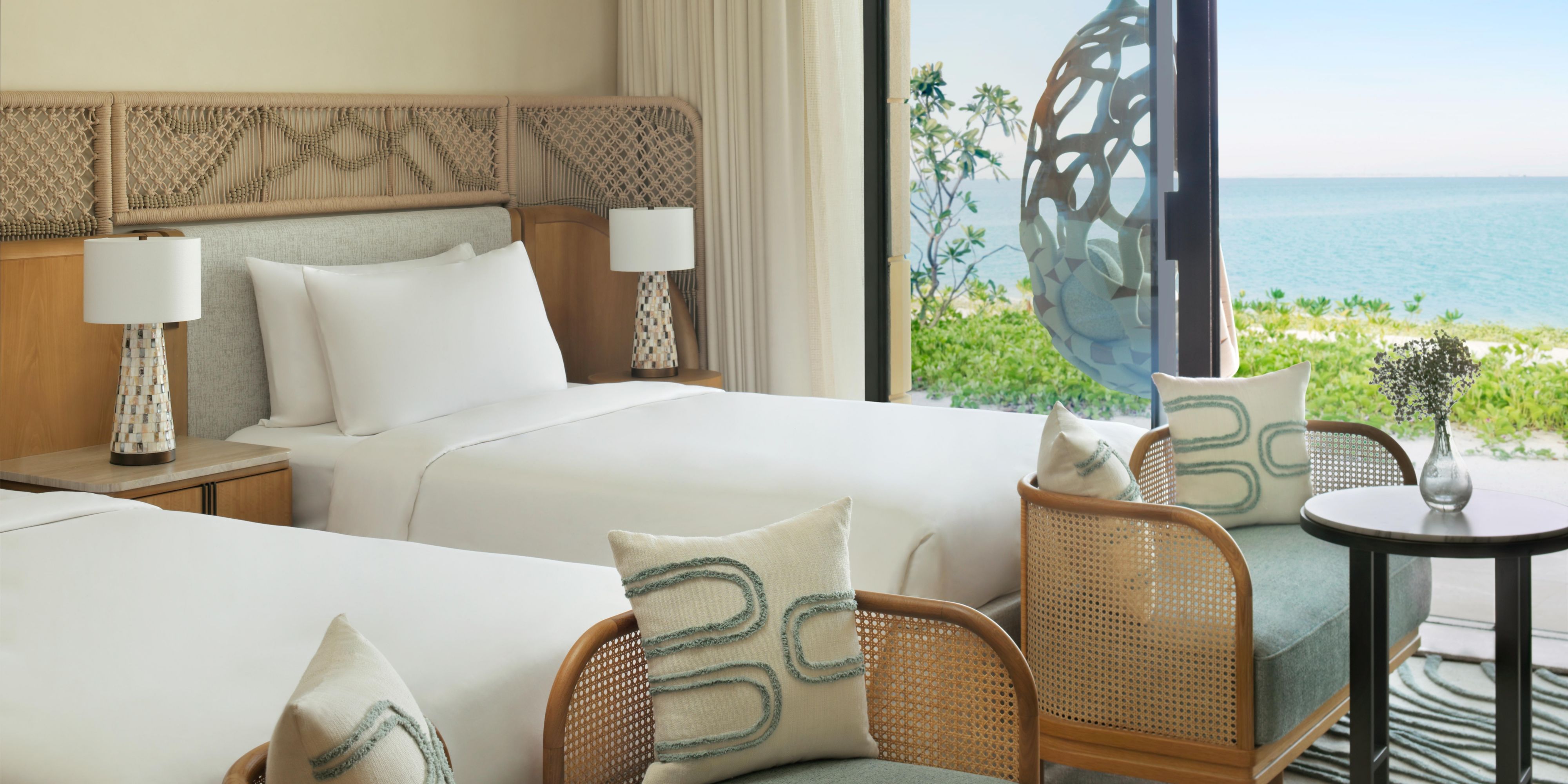 A serene twin room overlooking lush resort grounds