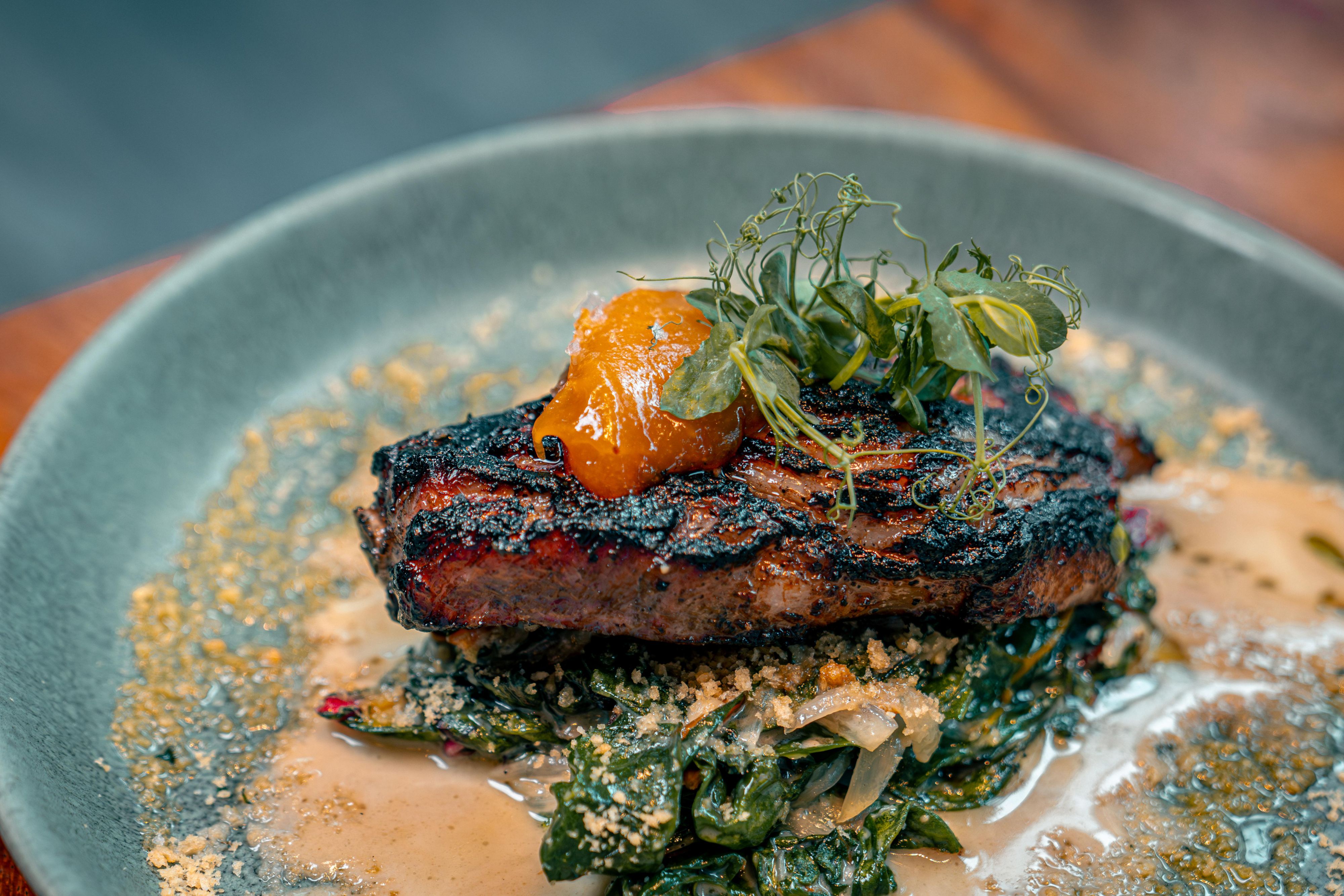 Grilled Maple Citrus Family Cow Pork Chop with nectarine jam.