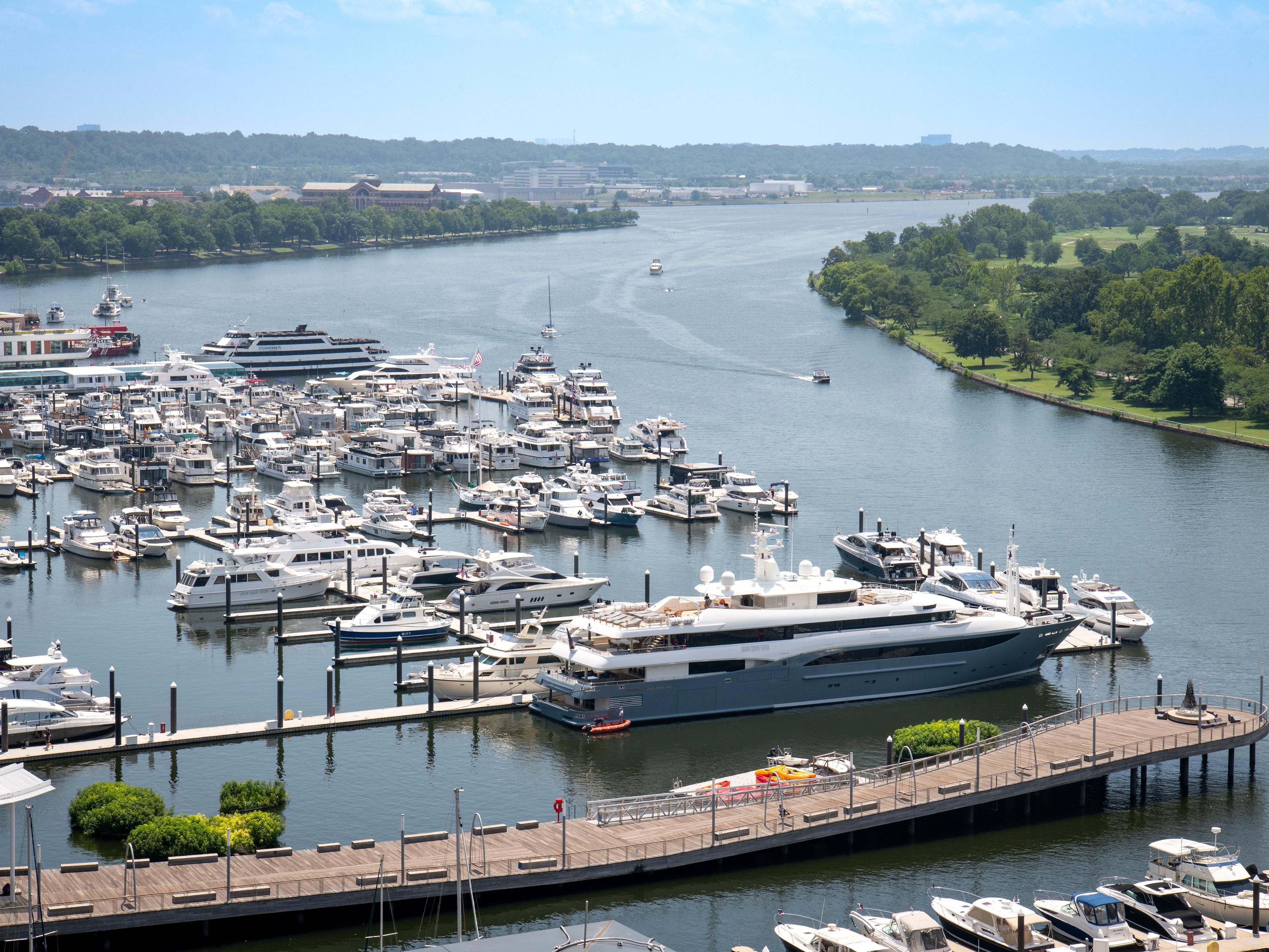 Marina on the Potomac with docked yachts and a wooden pier.