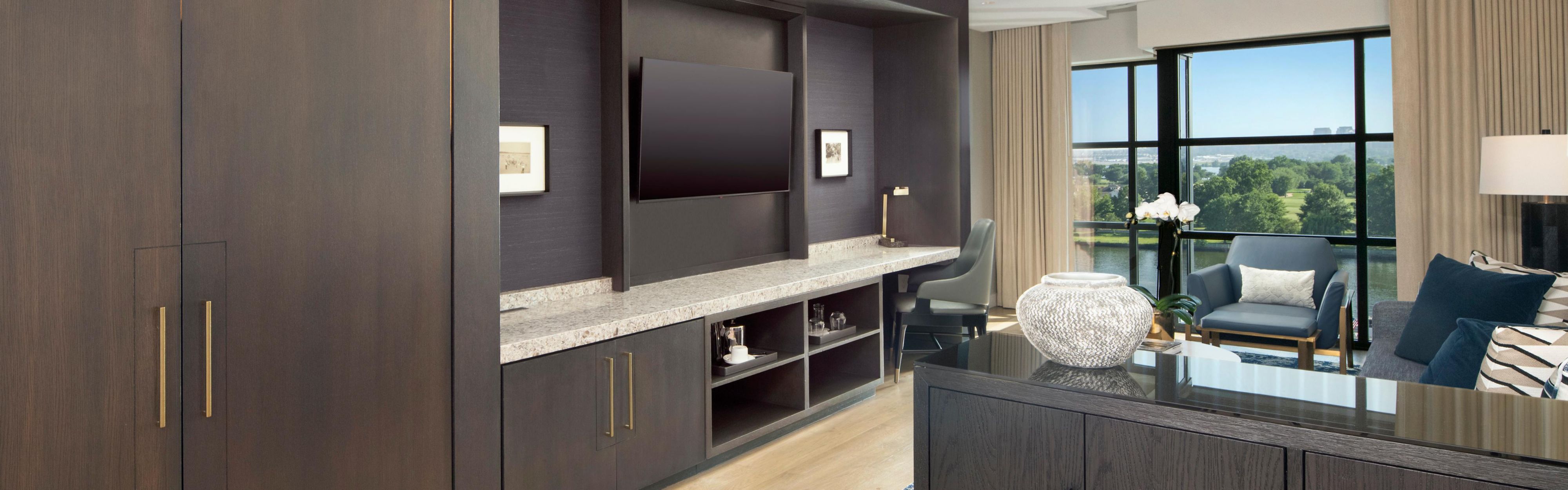 Compass suite living area with built in storage and tv console.