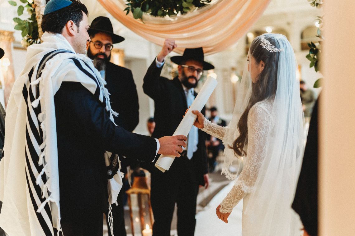 Bride and groom meeting together at alter